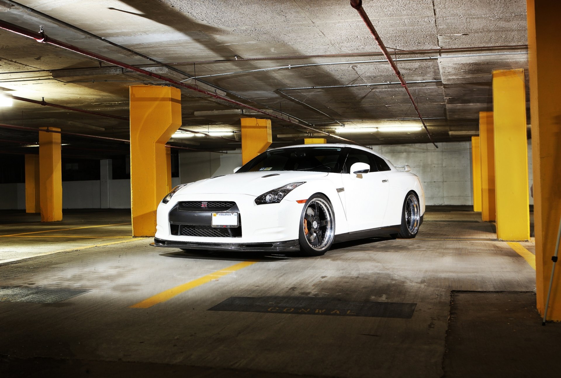 nissan gtr r35 white wheels gad drives license plate front parking column