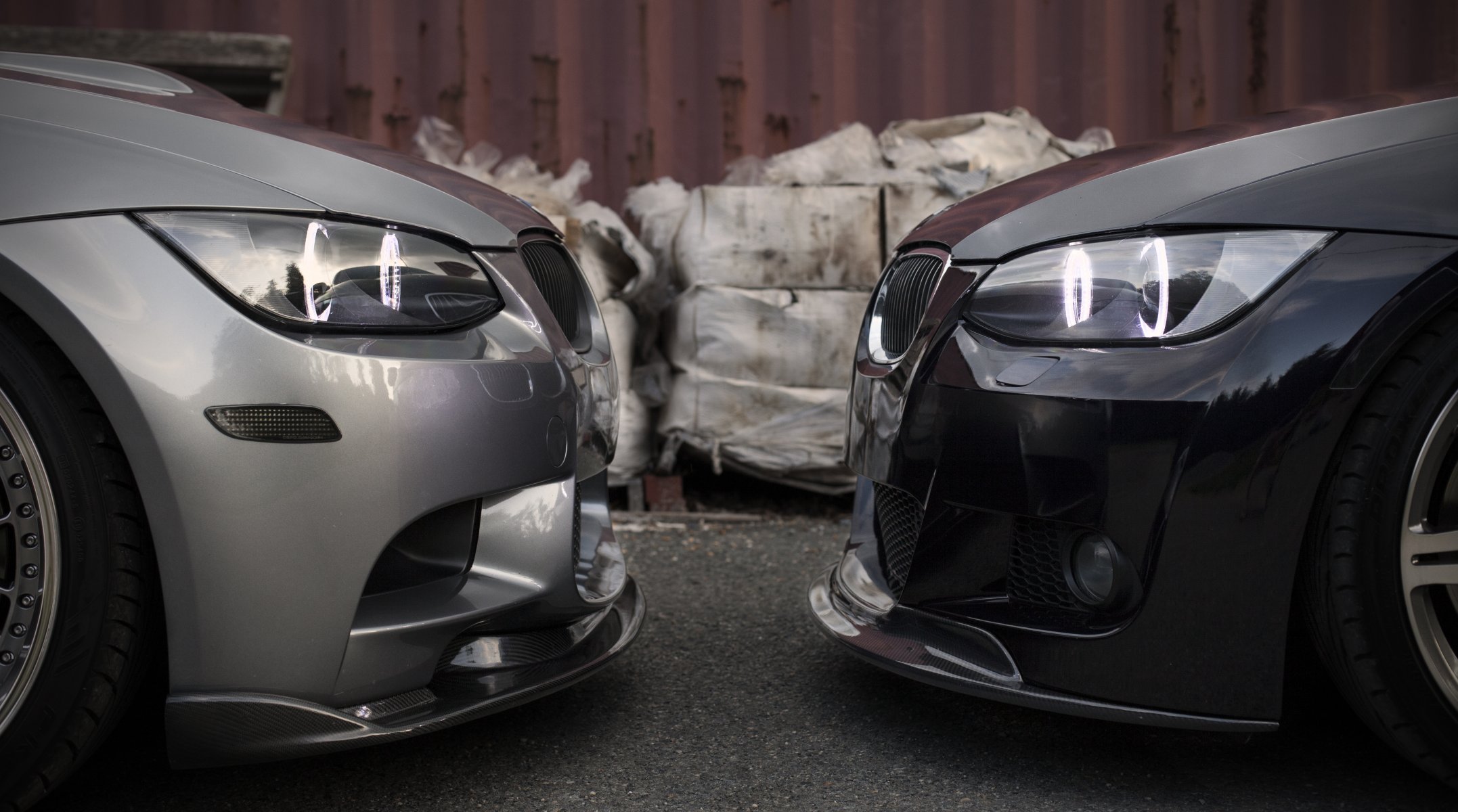 bmw m3 335xi e92 silvery black face to face silver front daylight