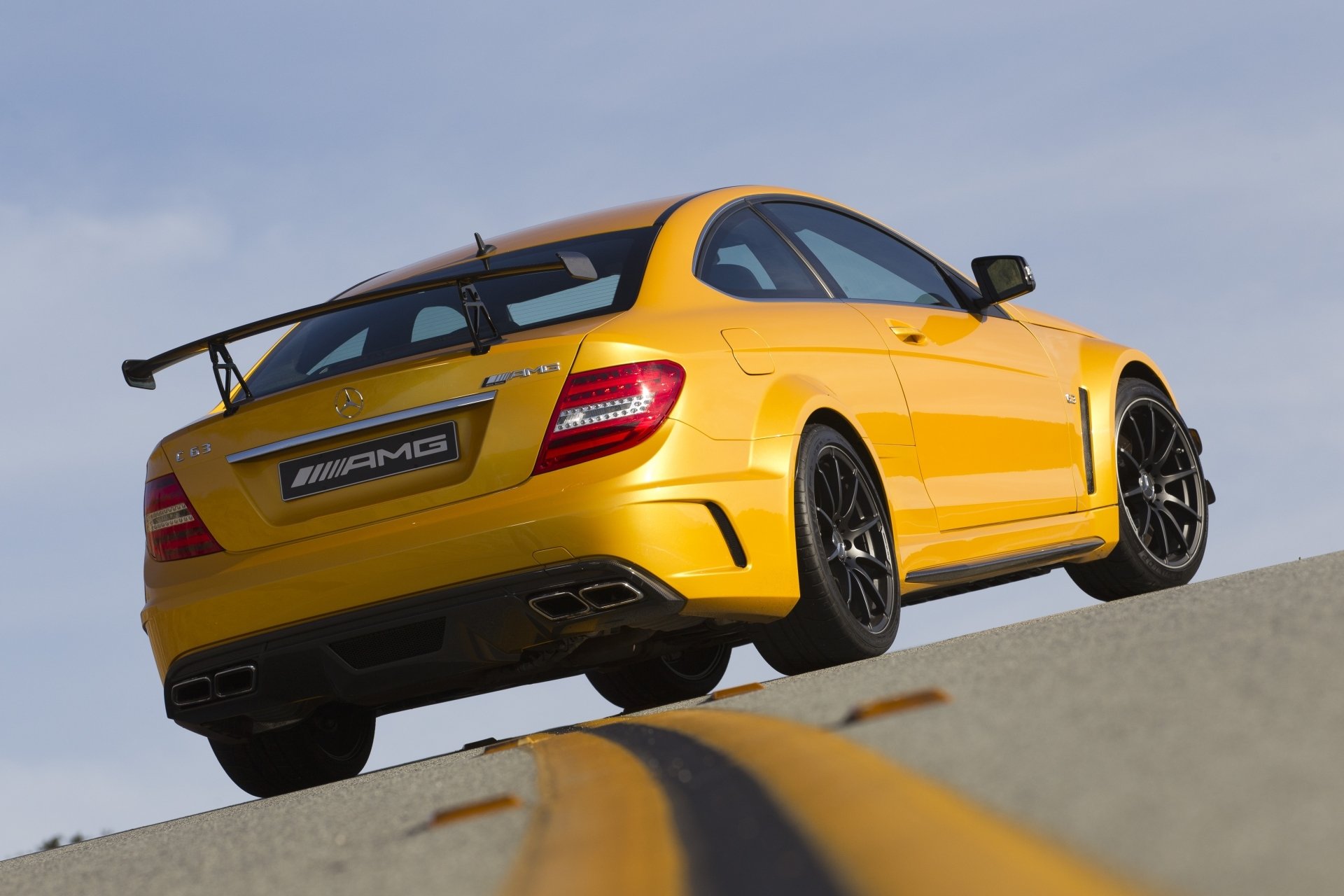 mercedes-benz c63 amg coupé black series mercedes c 63 sirius black yellow supercar rear view raceway counting sky