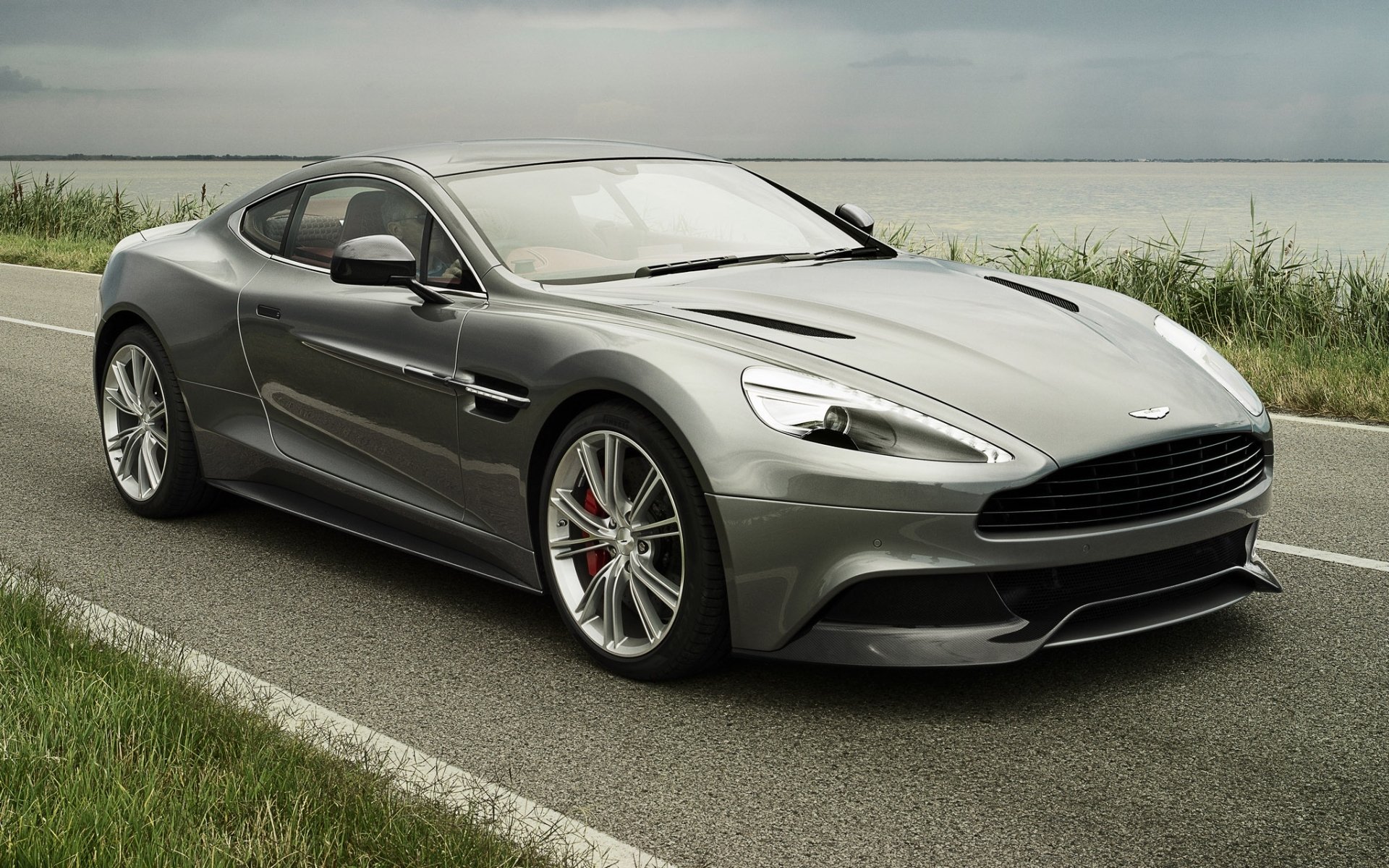 aston martin am 310 vanquish vankuish supercar front road sky