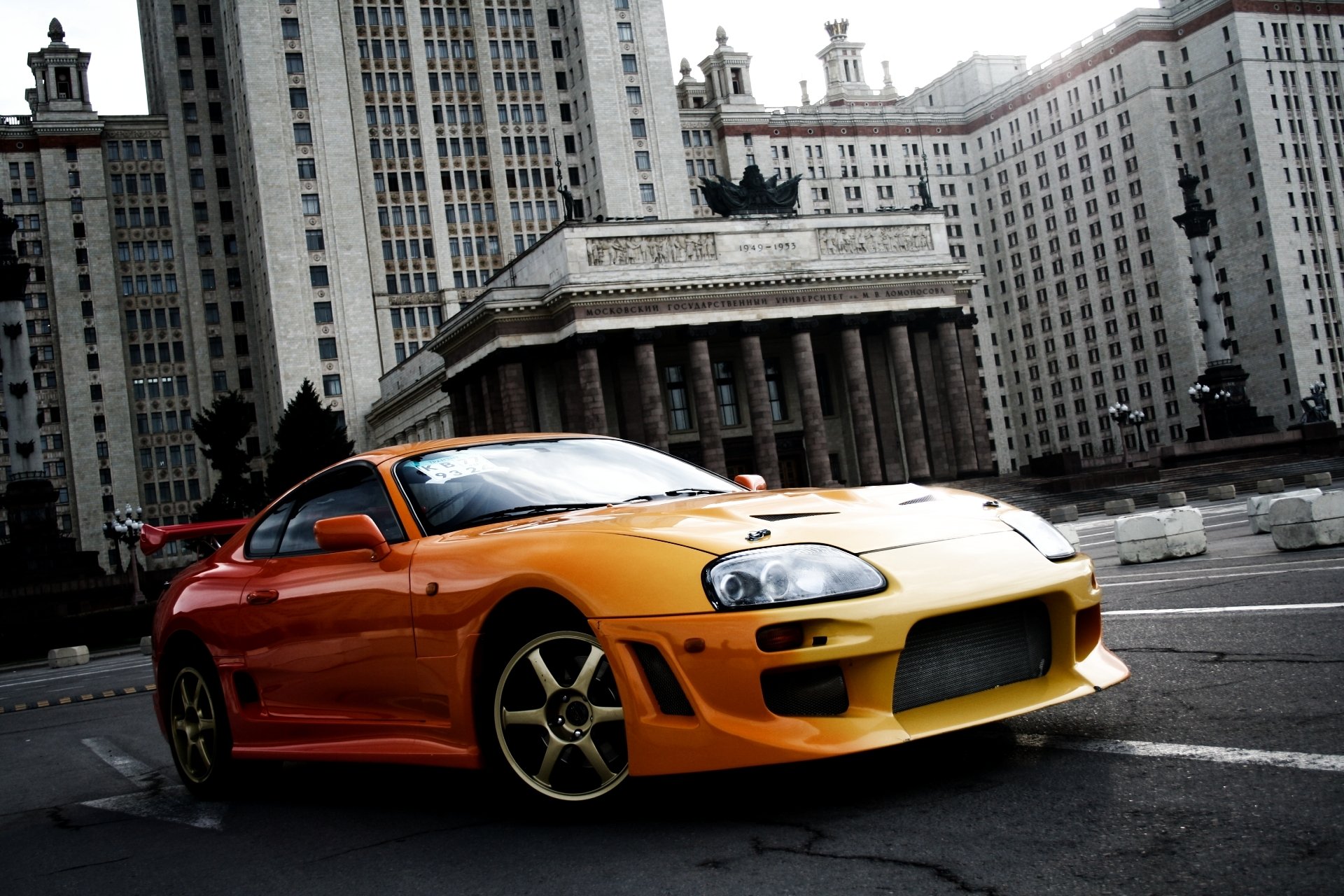 toyota supra sports car orange ancestor tuning building moscow state university background