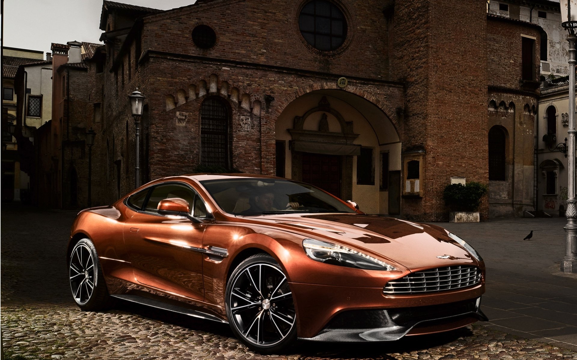 aston martin am 310 vanquish vankuish supercar front beautiful machine building background