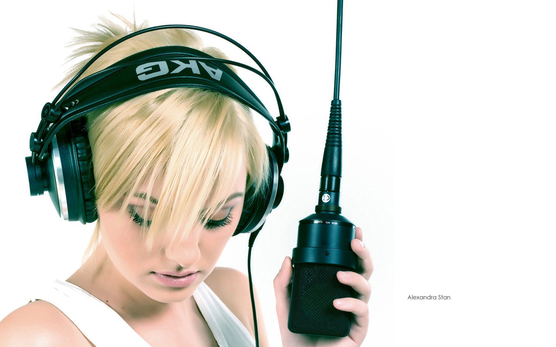 A girl with headphones and a microphone