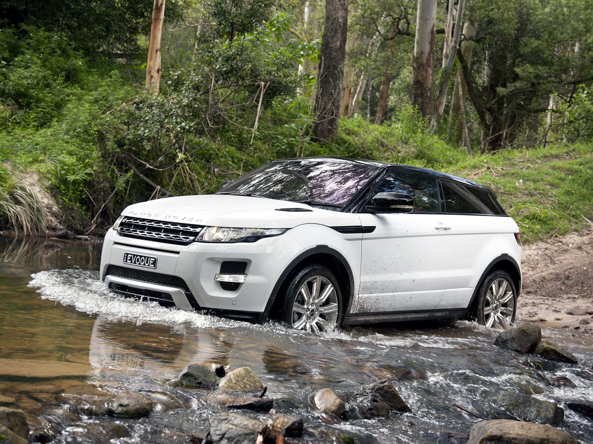 White Land Rover in the water