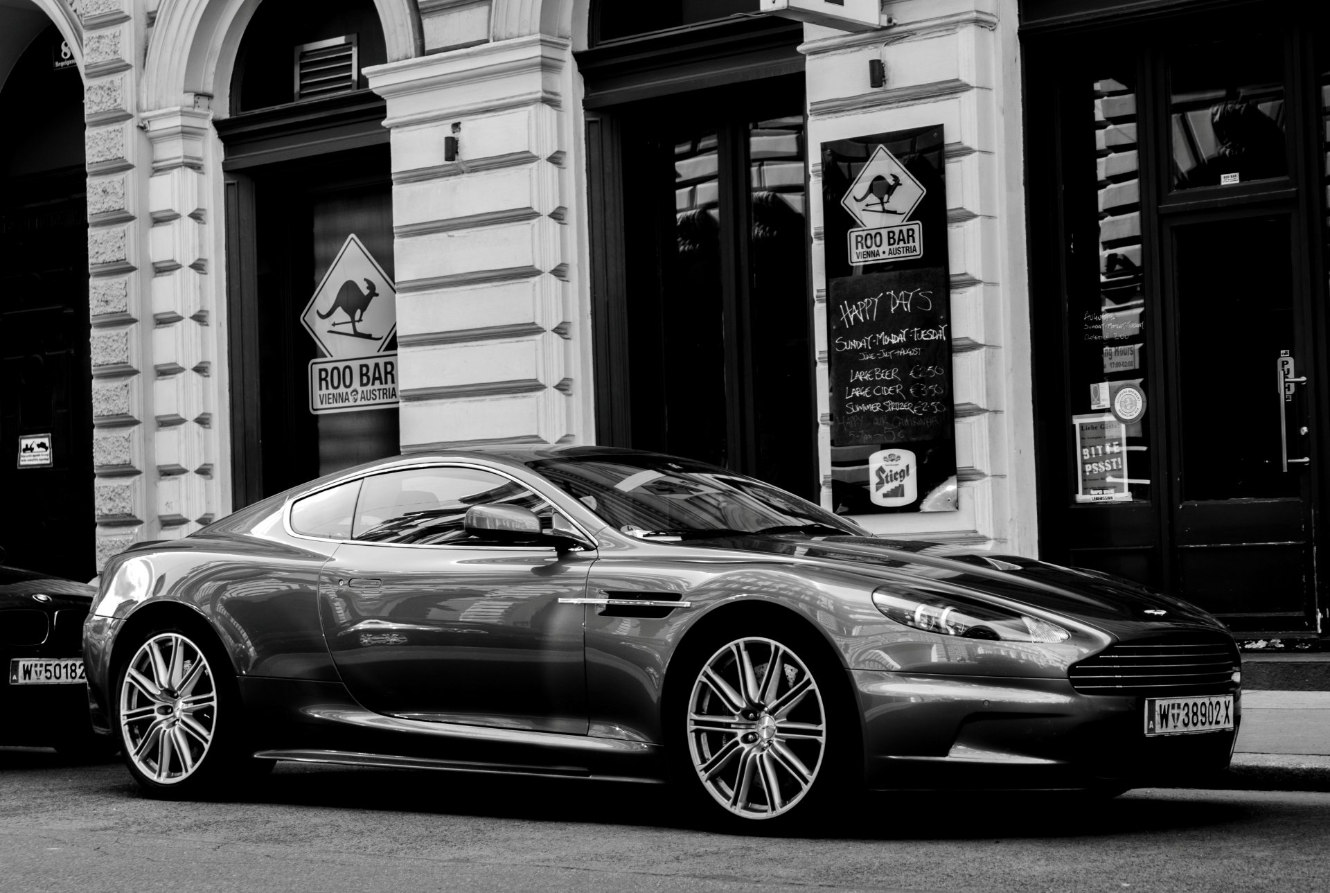 street vehicles aston martin dbs double coupe british company aston martin class gt photo black and white