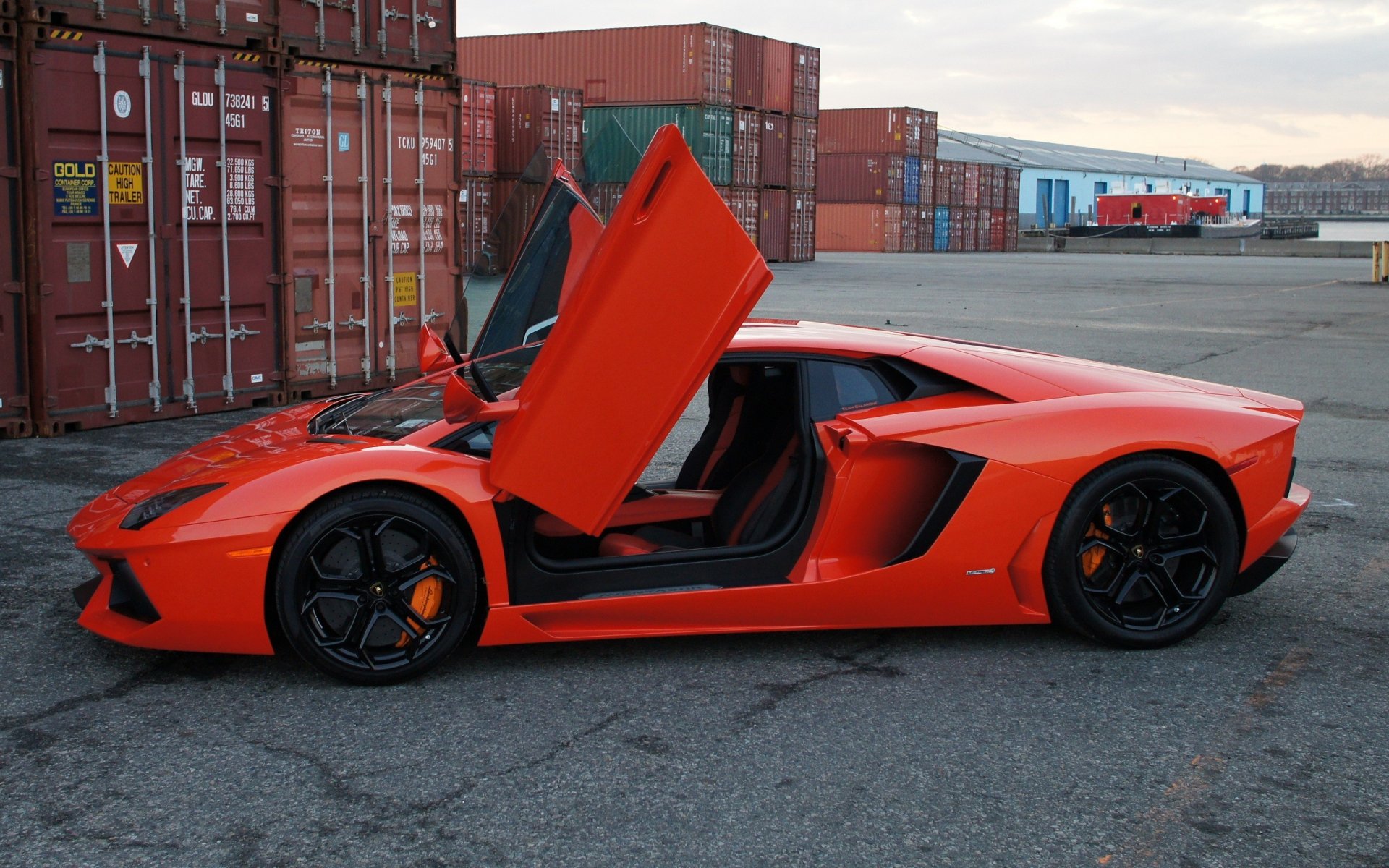 lamborghini aventador lp700-4 orange a side view of the door guillotine containers