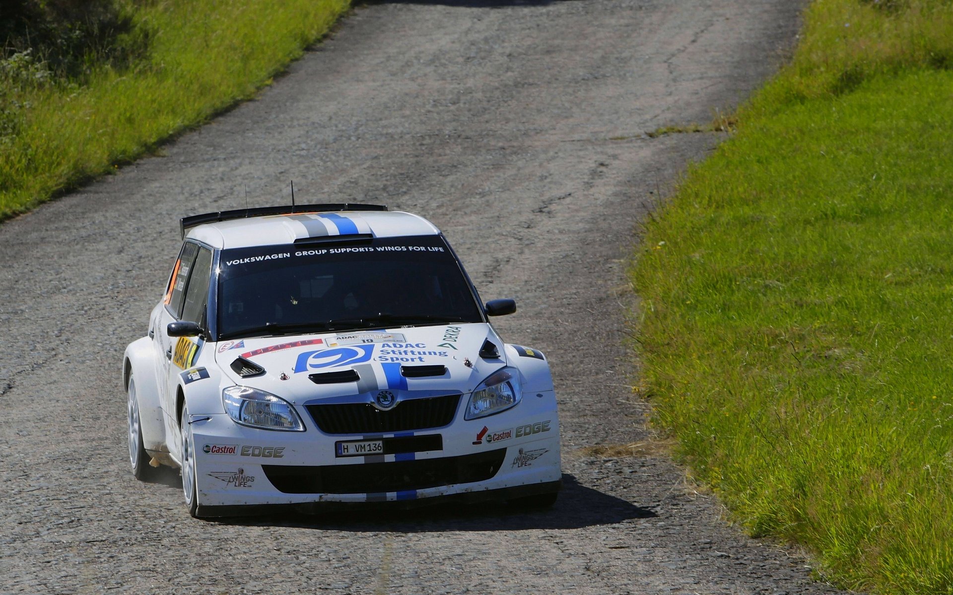 skoda fabia rally front white road asphalt competition