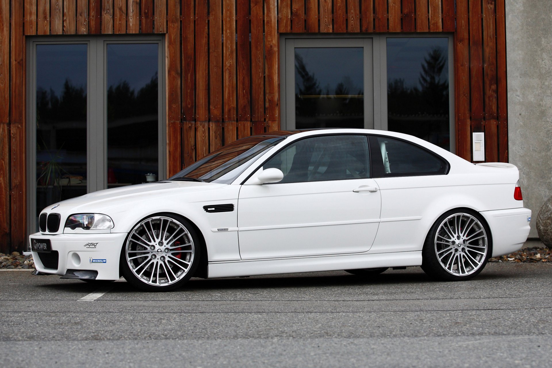 bmw m3 e46 white g-power a side view tuning mr. paver drives building doors asphalt