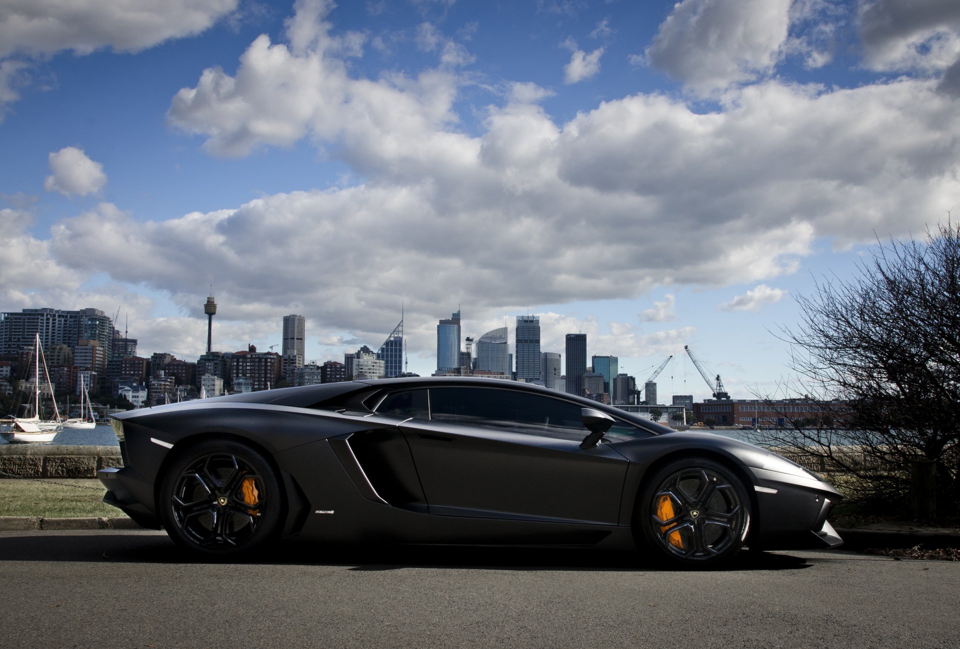 lamborghini aventador lp700-4 black matte black matt section shadow embankment town sky clouds