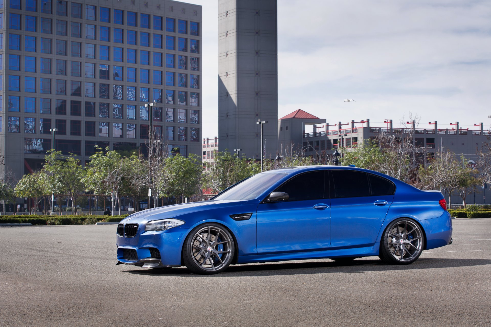 bmw m5 f10 monte carlo blue blue a side view drives building window