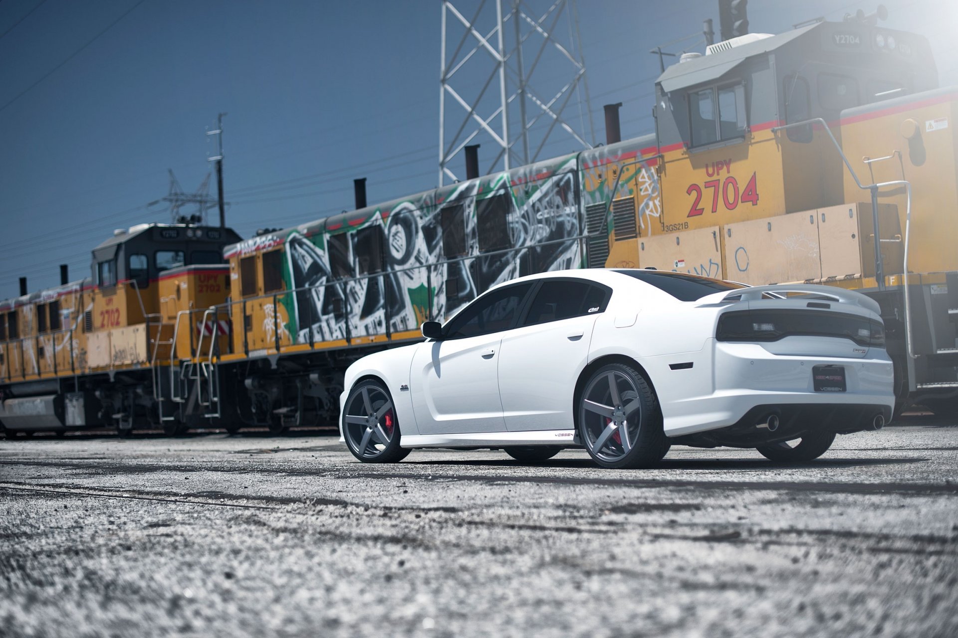 dodge charger srt8 white train graffiti.dodzh chardzher cpt rear view graffiti power line high-voltage support