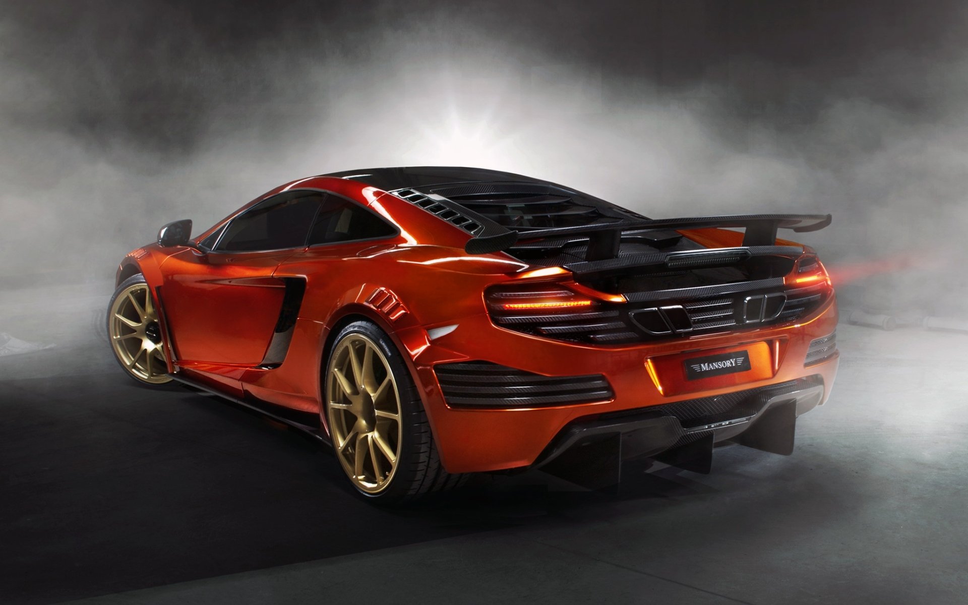 mansory mclaren mp4-12c supercar orange rear view tuning smoke background