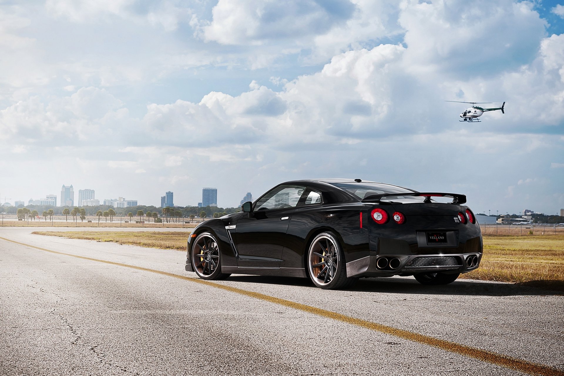 nissan gt-r r35 black gad rear view sky clouds