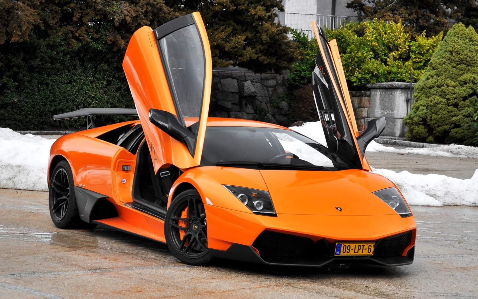 lamborghini murcielago lp670-4 sv murselago supercar orange doors front bush background