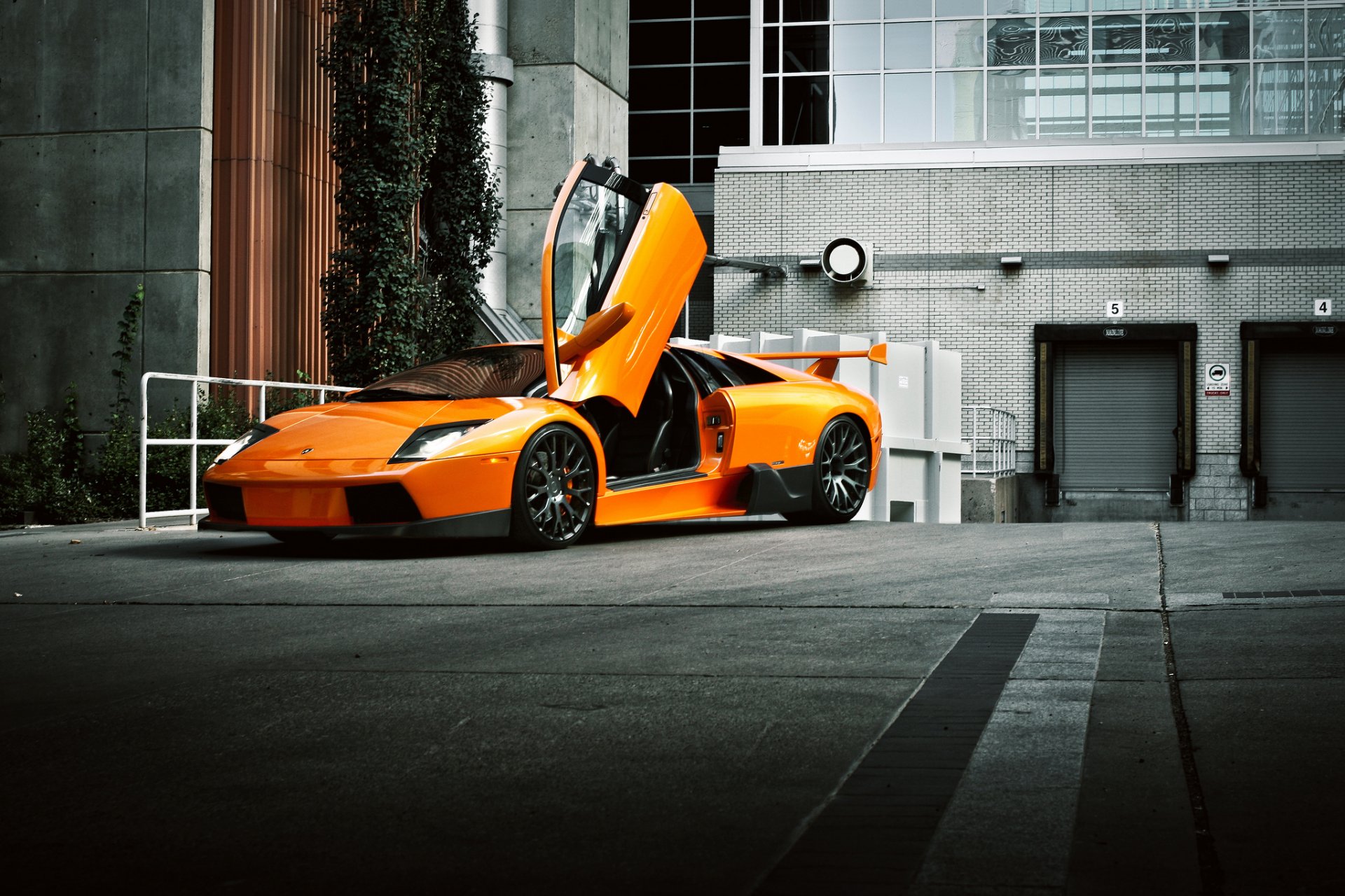 lamborghini murcielago orange front murselago open door building
