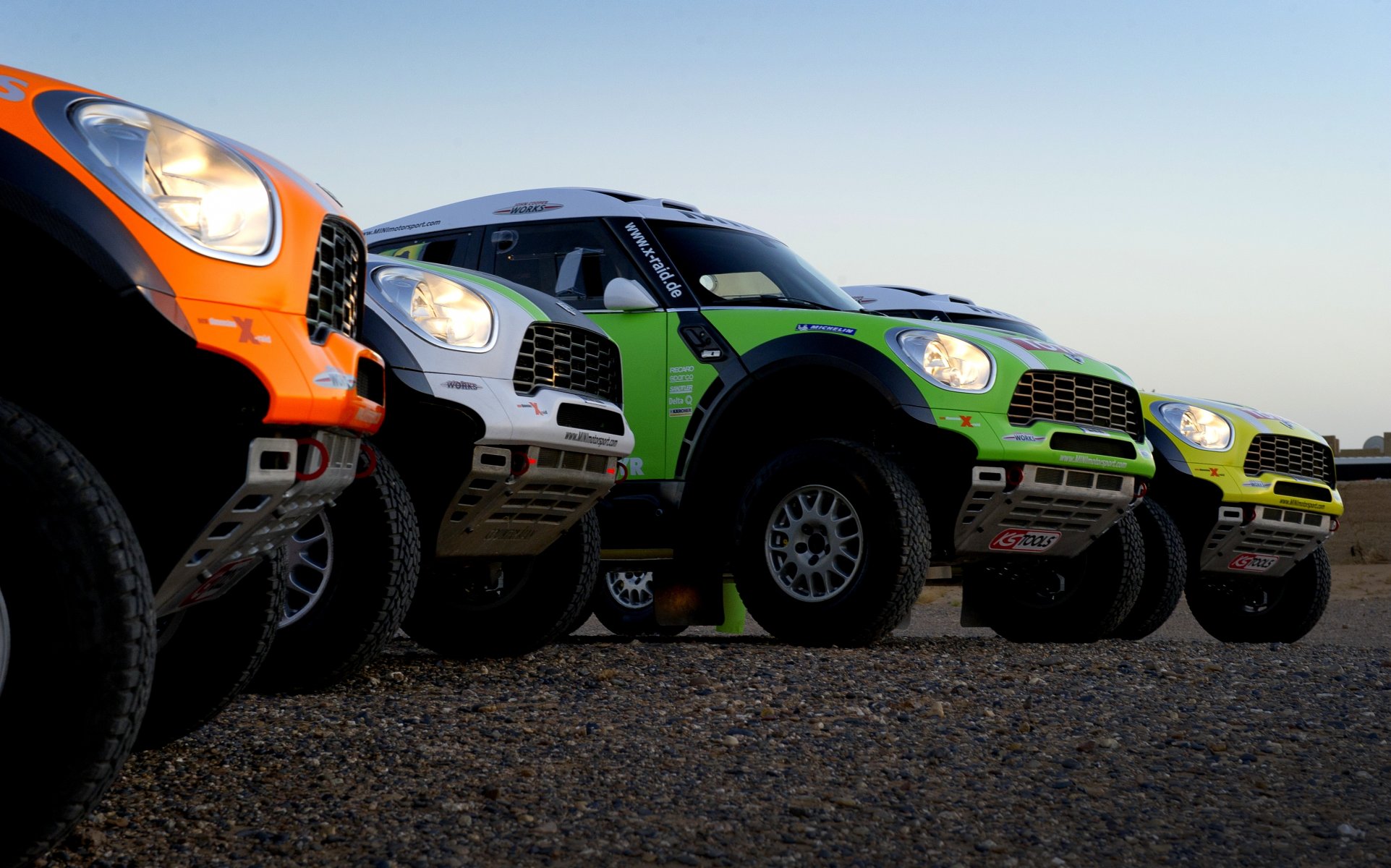 mini cooper mini x-raid car to dakar dakar rally four orange white green yellow light suv