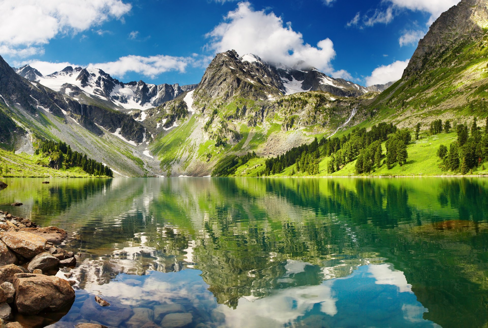beautiful greenlands hyaline lake high mountain snow transparent lake reflection sky white clouds