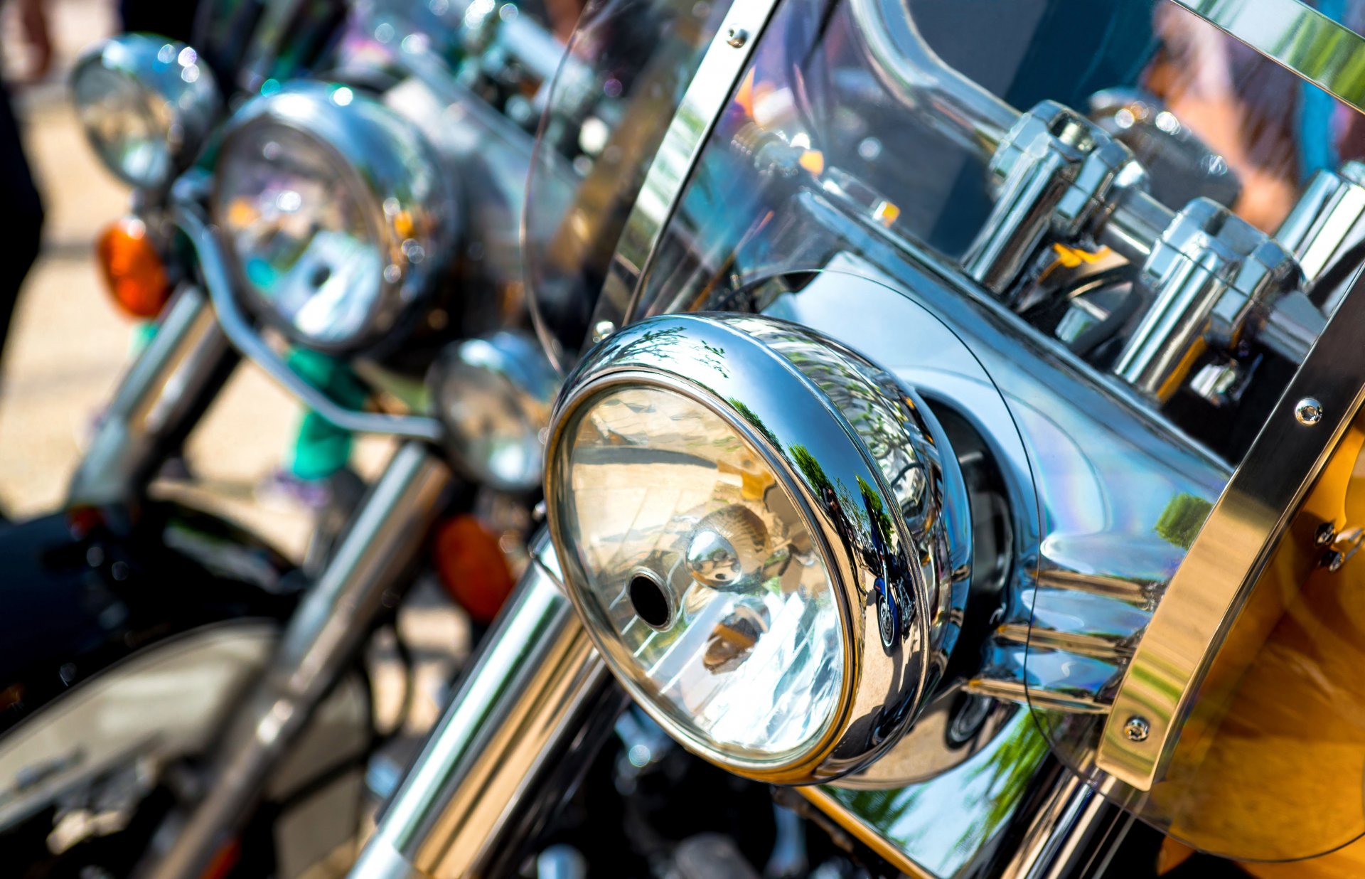 bike moto bikers team light front parking town sunny day feel of speed full throttle blur bokeh close up wallpaper.