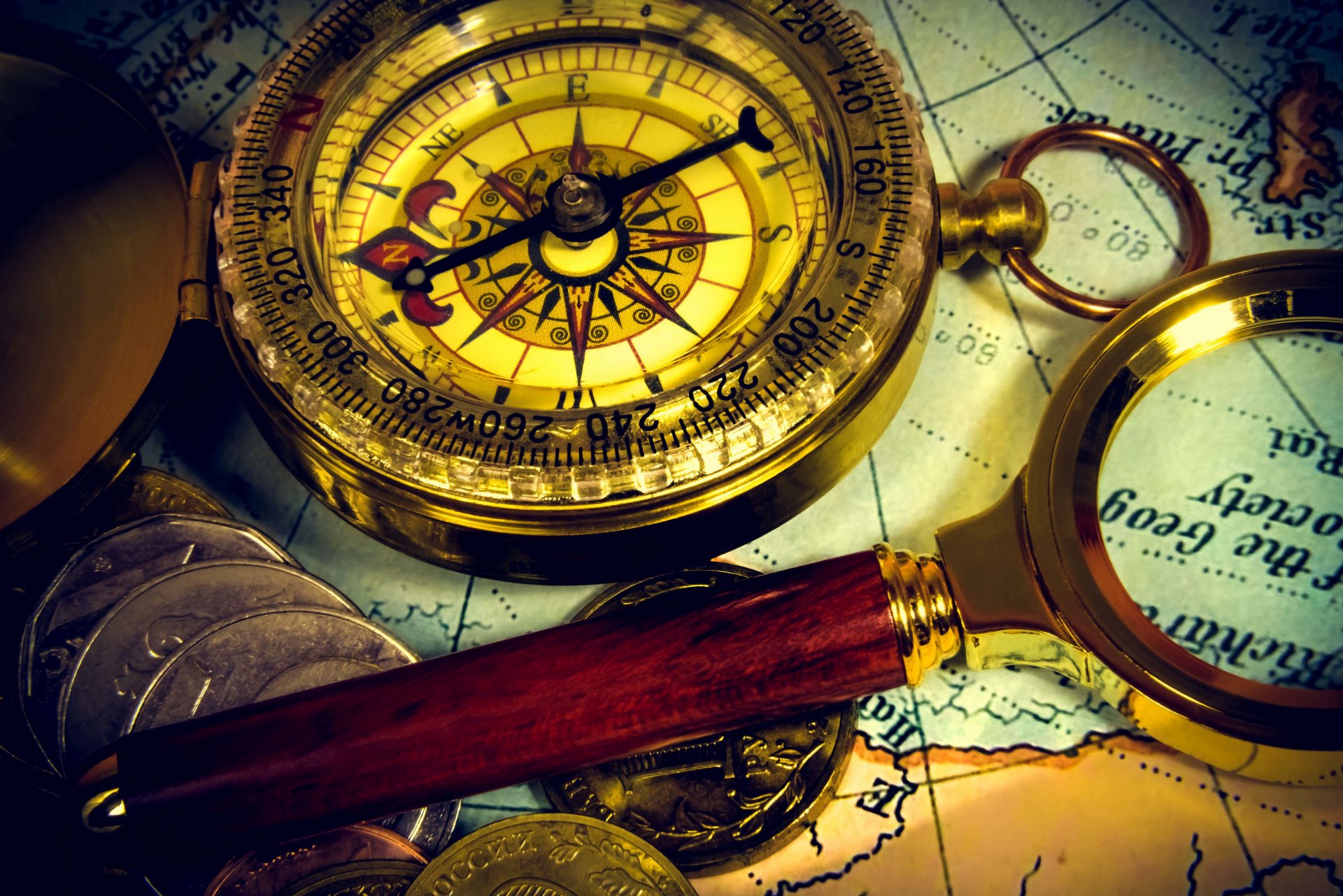 composition ancient map vintage compass magnifier coins travel blur bokeh wallpaper.