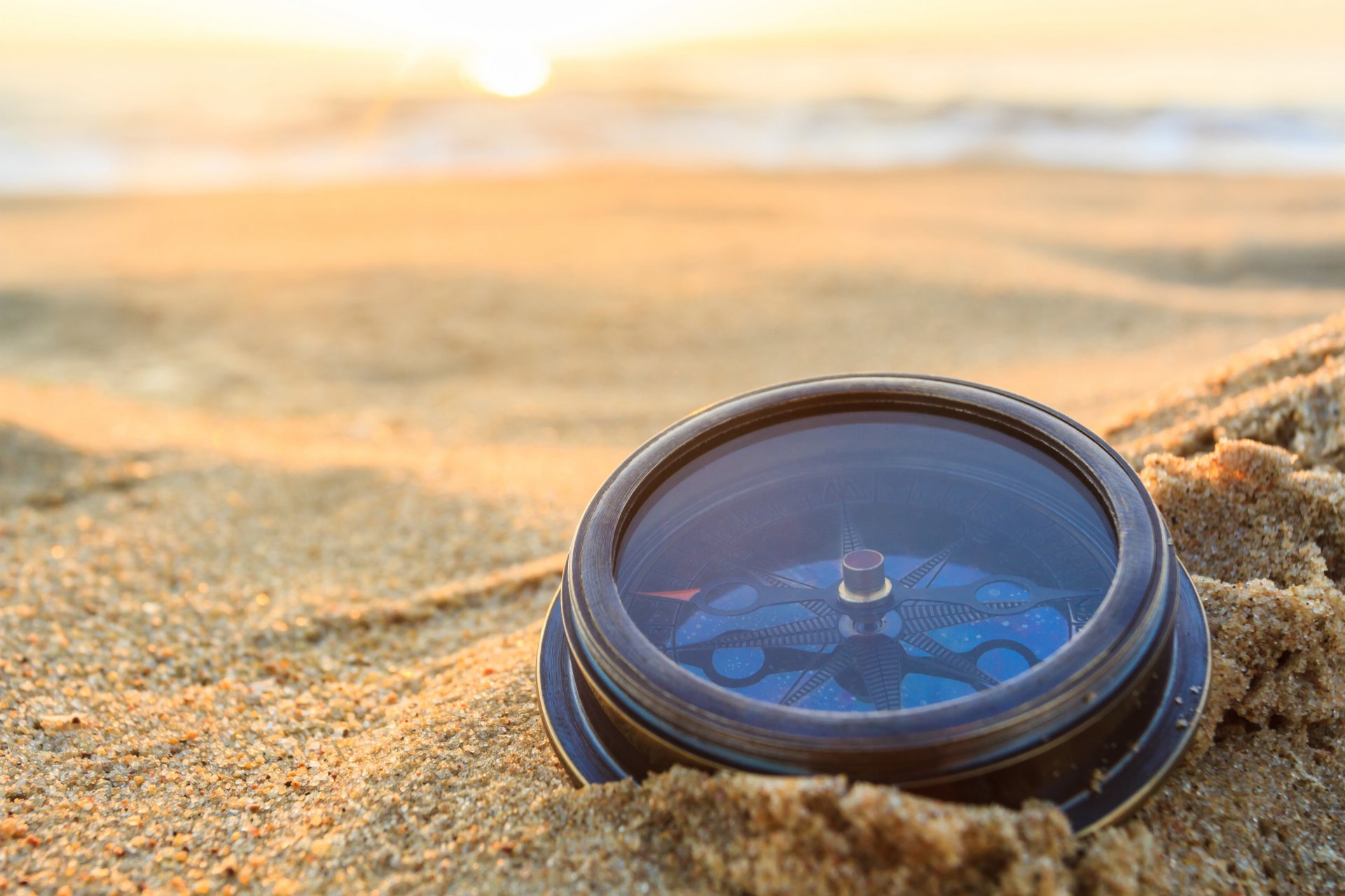 compass the mechanism dawn sunrise sun sand waves travel blur bokeh close up wallpaper.