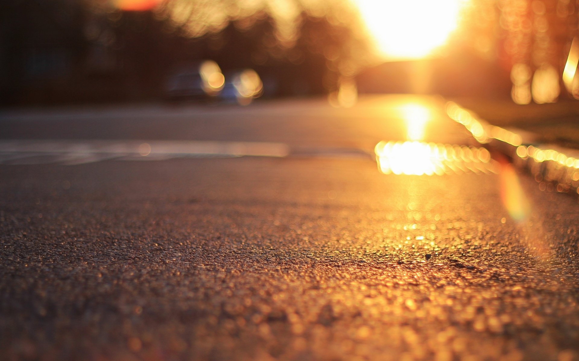 close up land asphalt sun rays bokeh blur background wallpaper widescreen full screen hd wallpapers