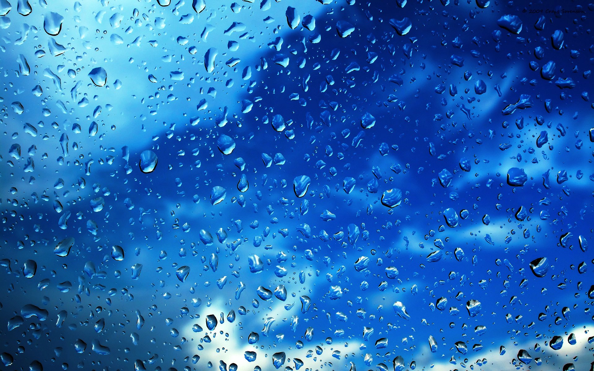 close up drops glass sky clouds