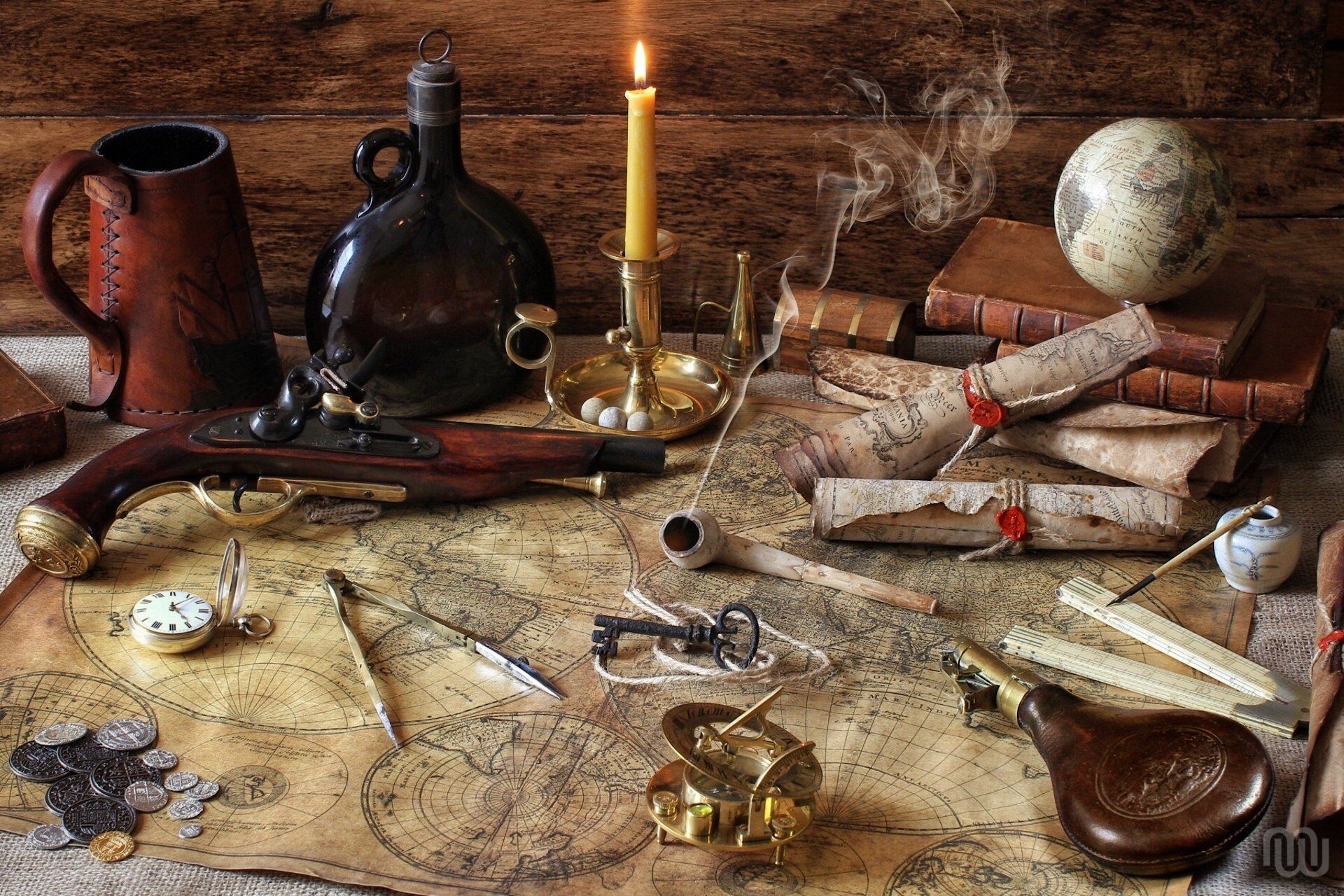 pistol cards globe compasses a bottle books coins tube candle compass key