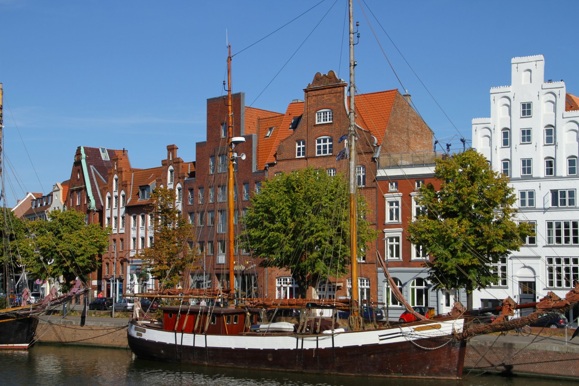 lübeck germany lubeck sailboats galleass embankment buildings