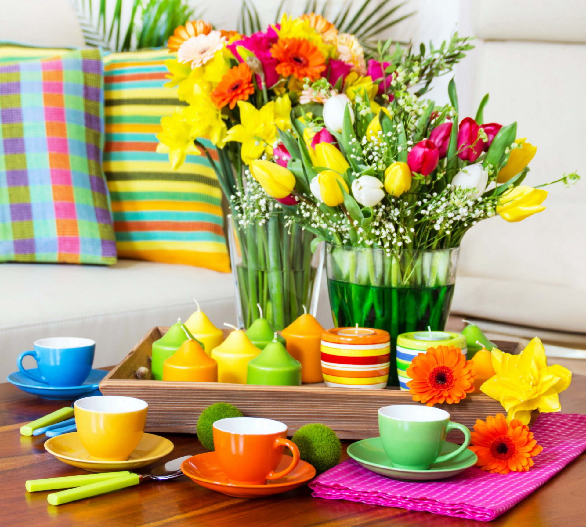 colorful arrangement serving flower cups candles colored tulips pillow wipes table