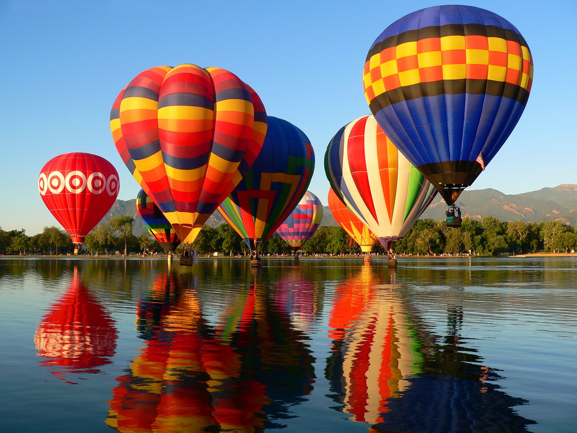 colorado springs balloon classic balloon hits sky mountain lake tree
