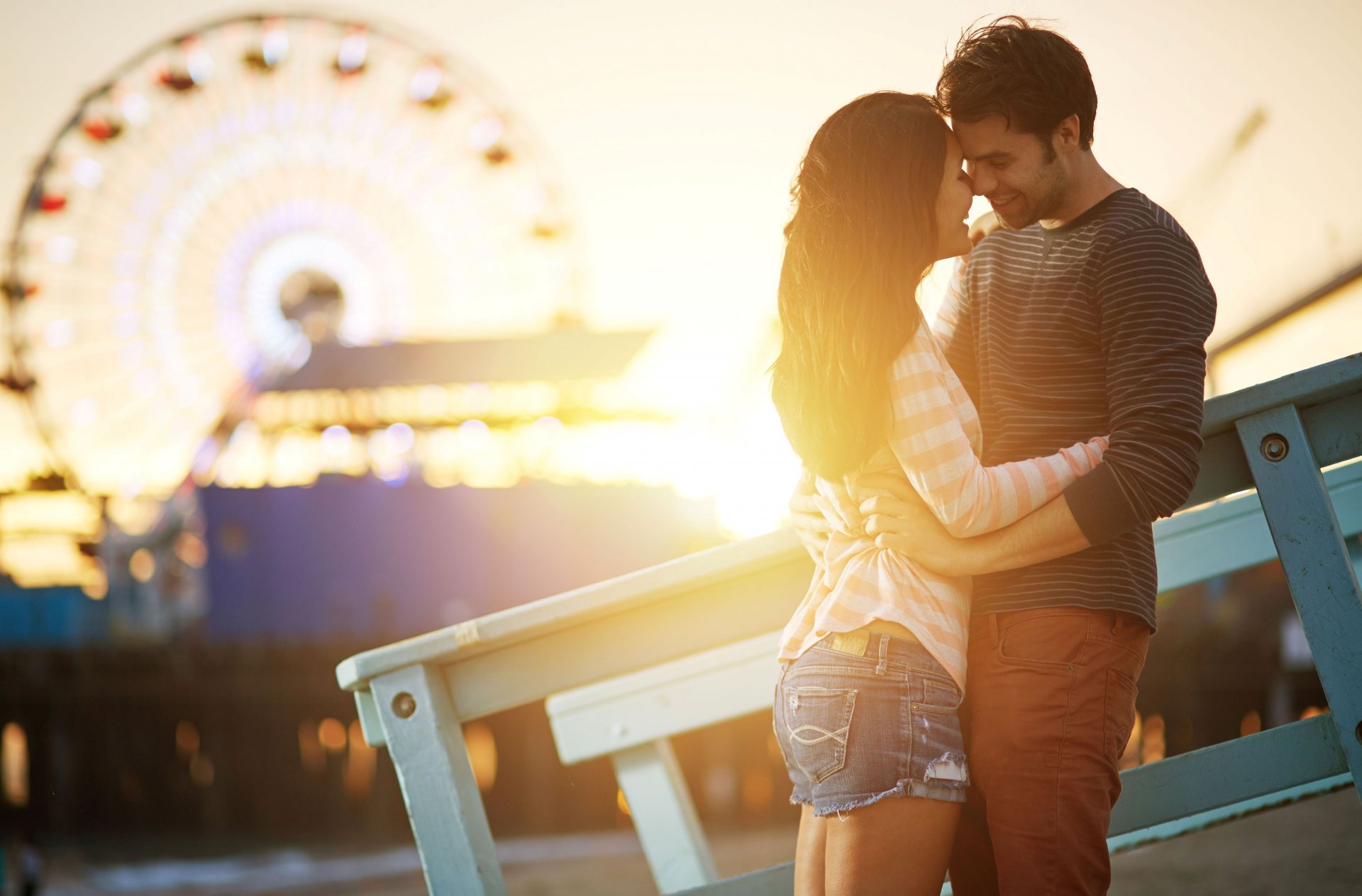 mood girl guy the pair couple love feelings heat smile happiness good mood shorts hug black brunette ferris wheel blur bokeh attractions sun rays woman men human happy