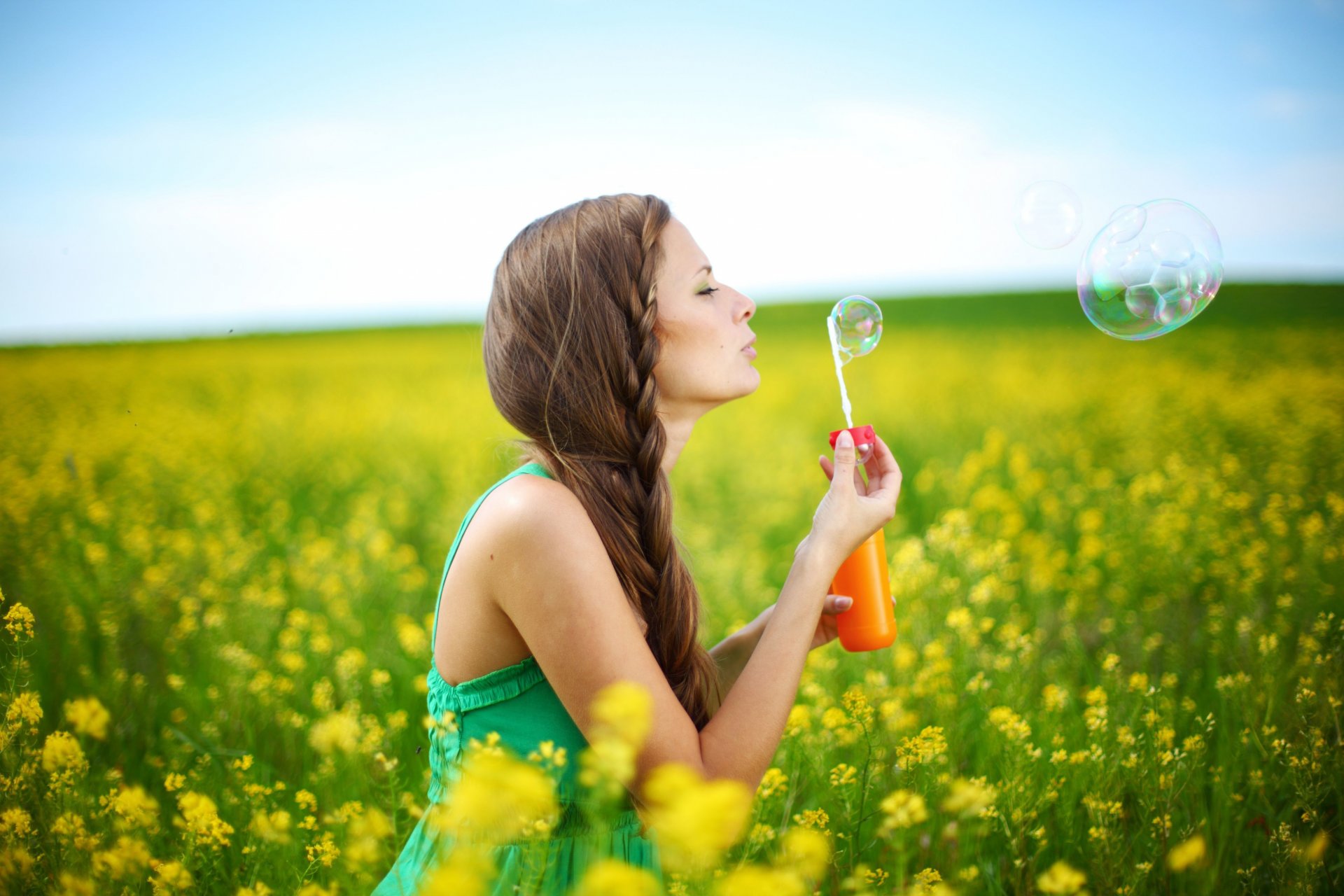 mood girl brown hair pigtail hair style summer dress bubbles plants nature flower flowers yellow background sky a woman brunette positive happiness freedom hands smile plant tree leaves is widely