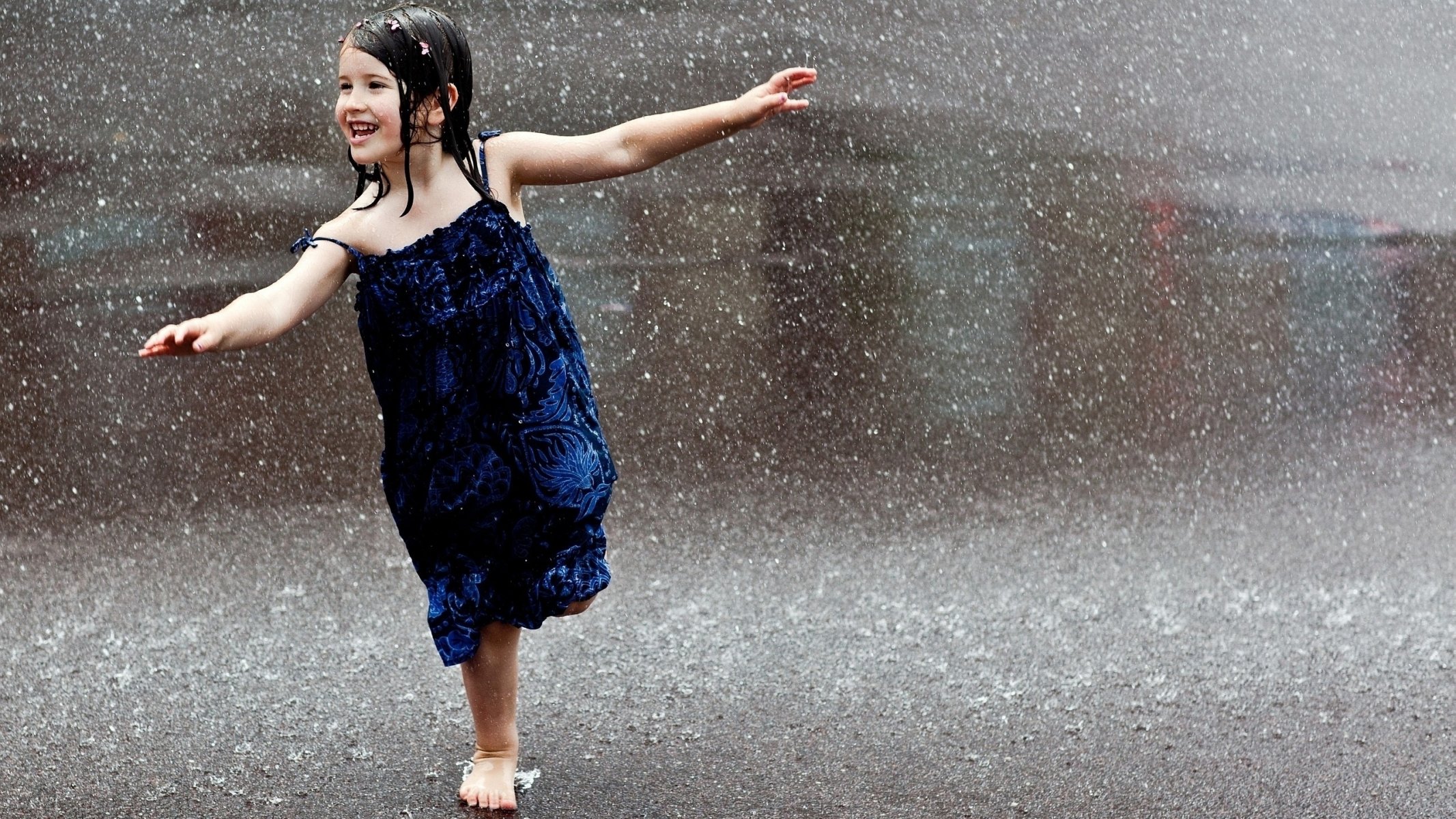mood girl brunette hair child children wet rain barefoot happiness laughter fun on one leg blue dress smile road figure pose plane drops close up street town wallpapers widescreen 2560*1440