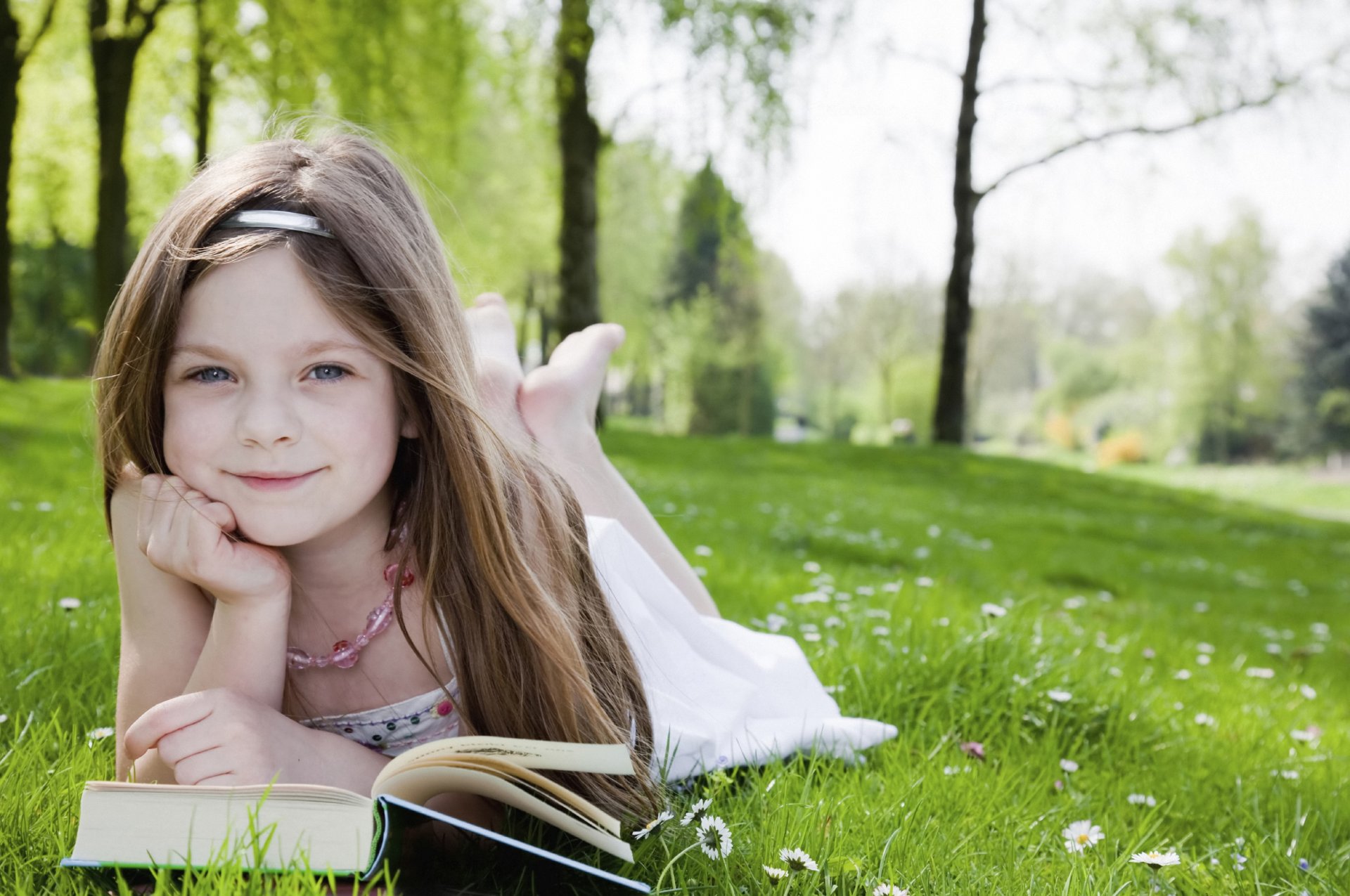 cute little girl lovely beautiful blonde happy joy happiness reading garden park trees grass book cute supplies tree books child children childhood