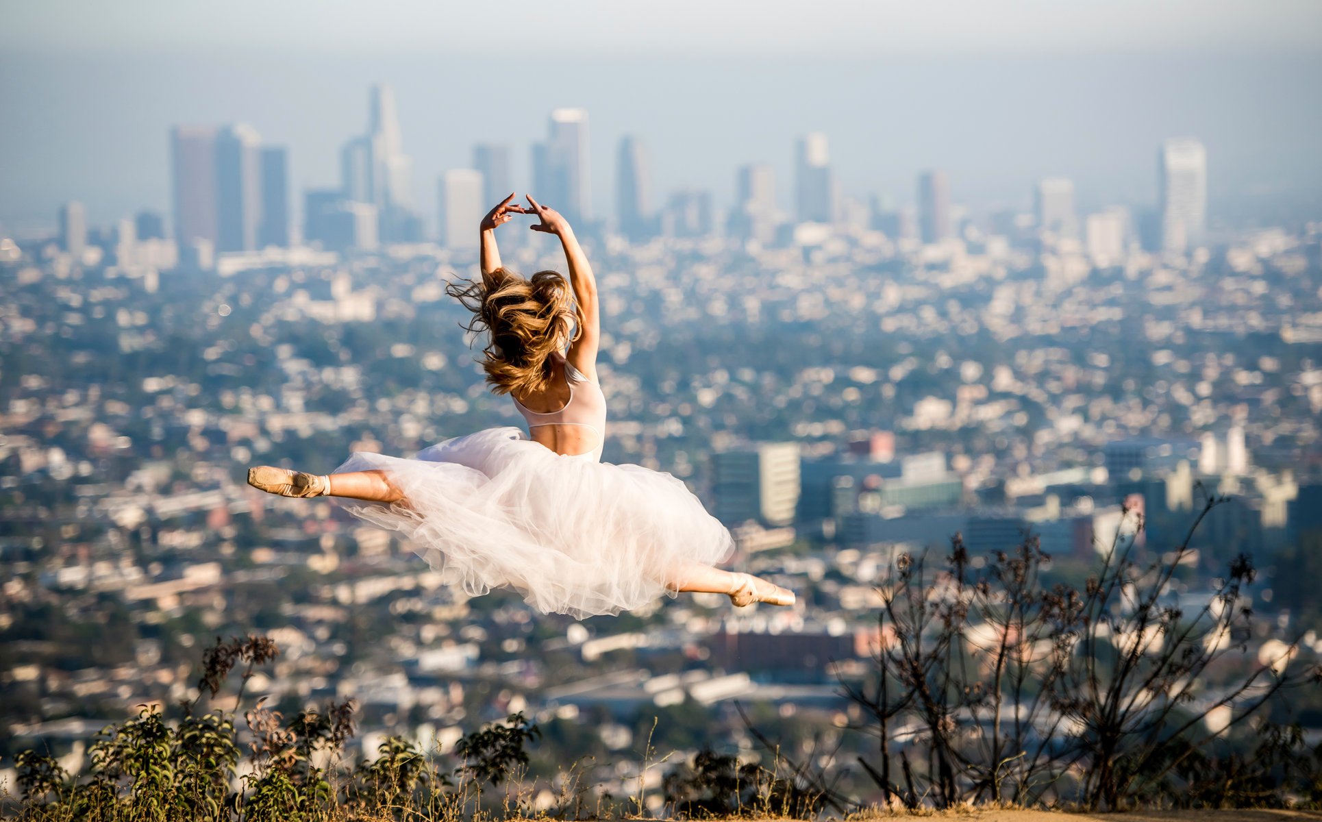 beautiful ballet ballerina pointes dress jump in the background town los angeles