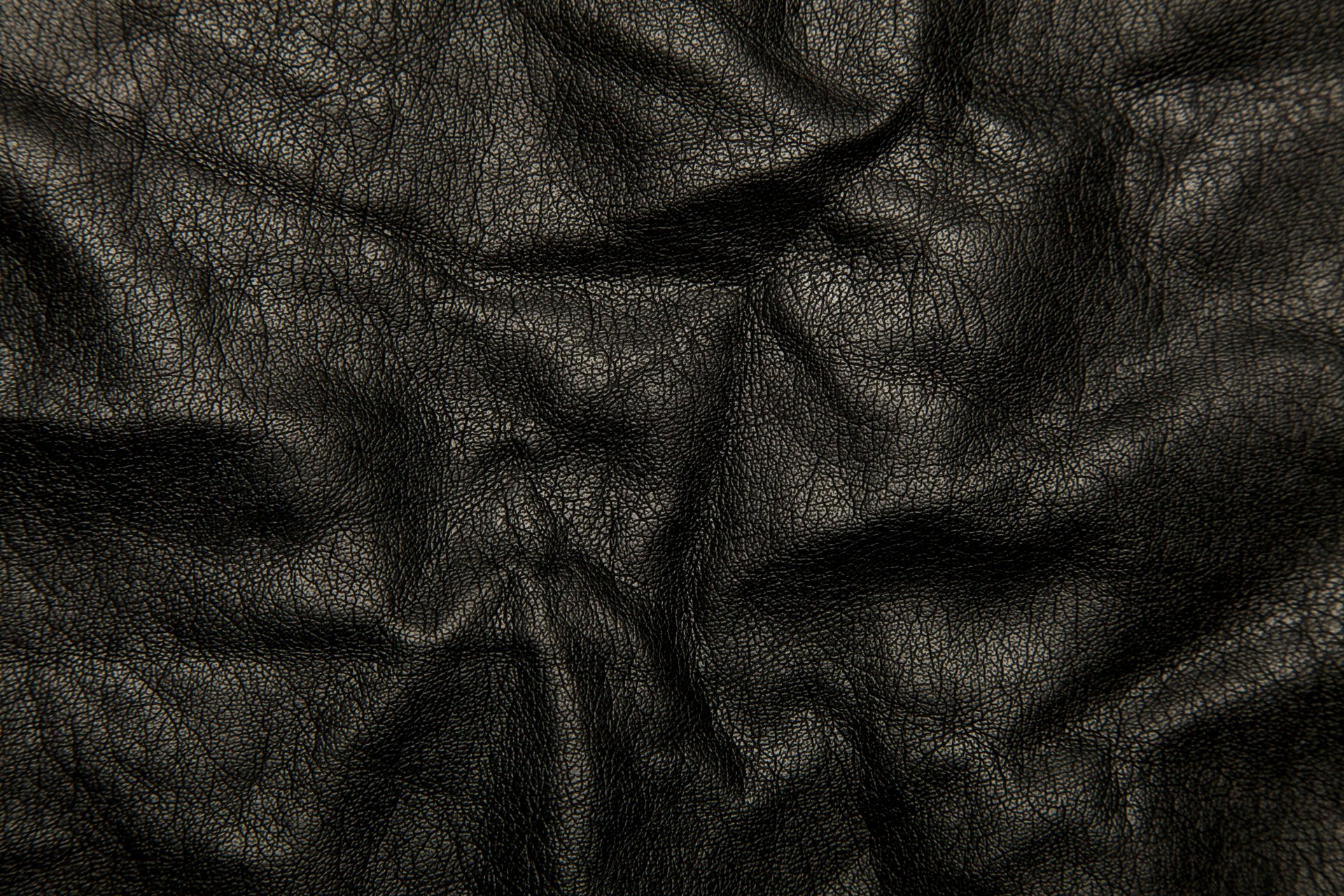 leather black background textures folds of the crack