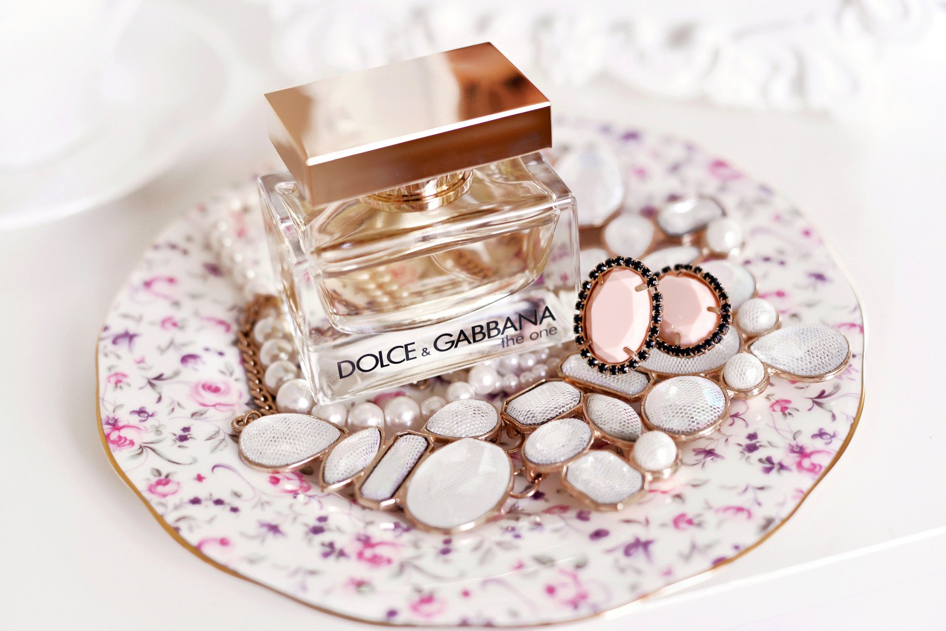 the one dolce & gabbana perfume bottle stones earrings beads dish