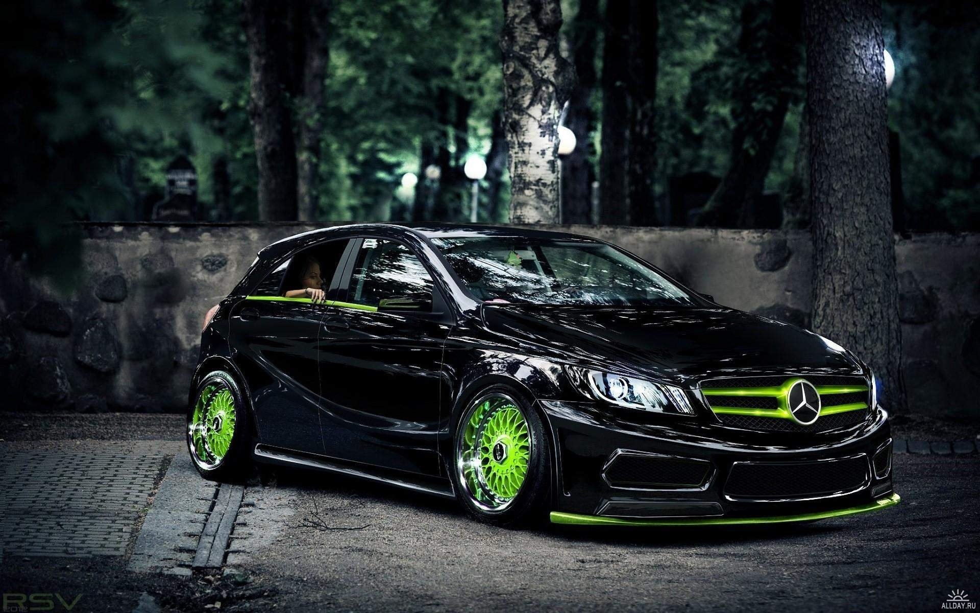 A beautiful car with green wheels