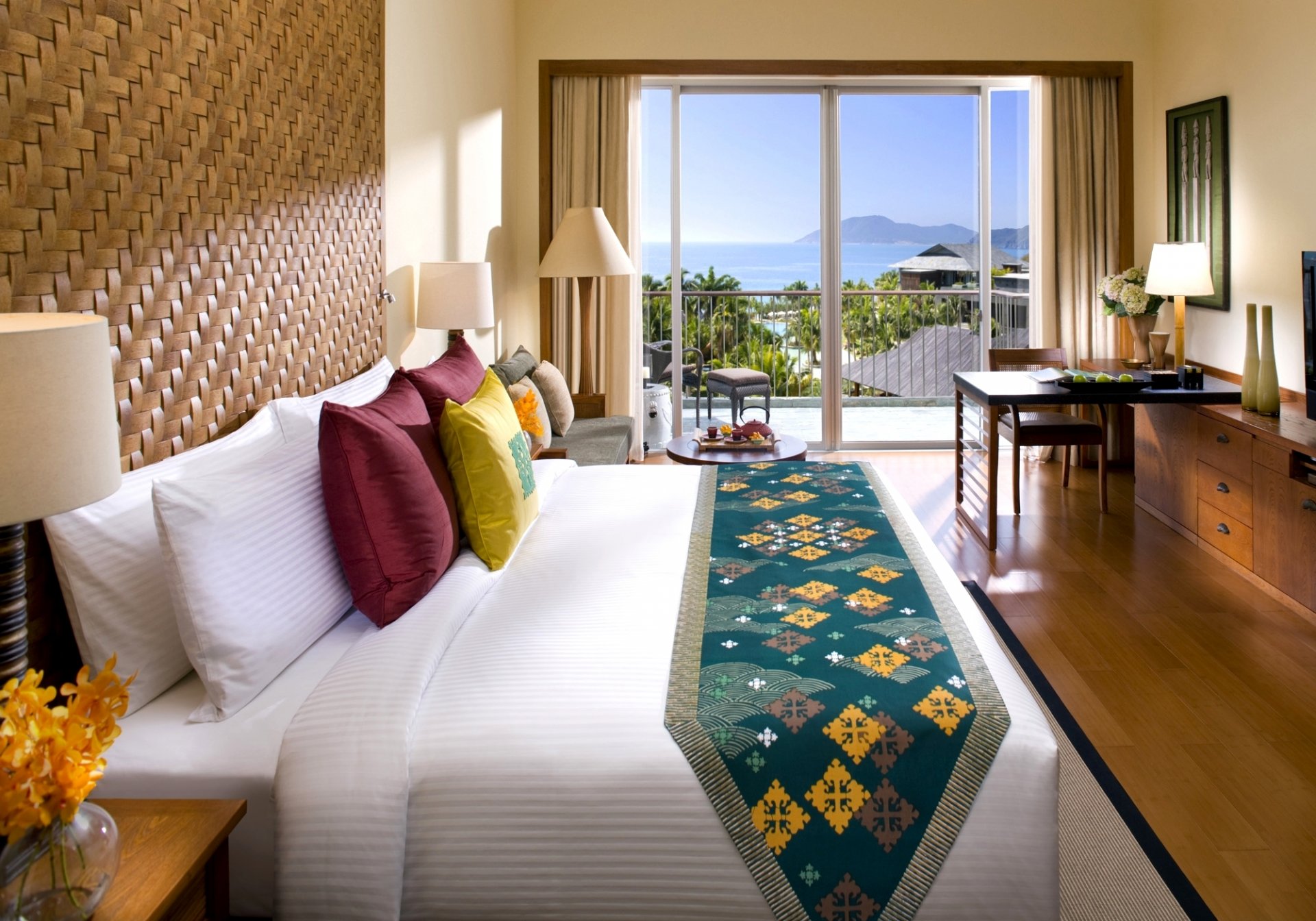 interior style design light beige bedroom room bed pillow vase flower table chair bulbs sofa balcony views palm sea resort town sanya