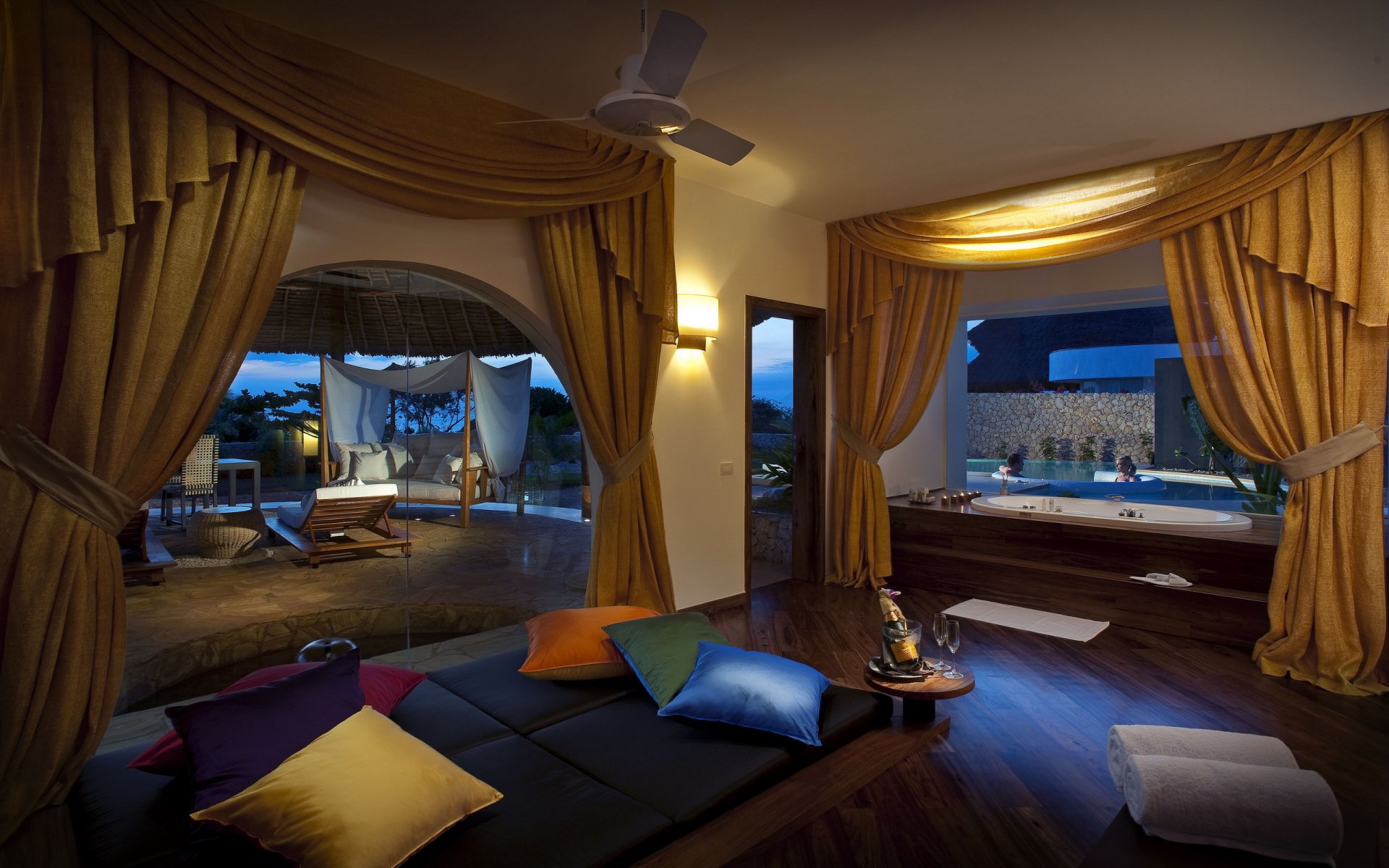 interior room bathroom curtains yellow colored cushion large windows champagne pool people two in the jacuzzi night