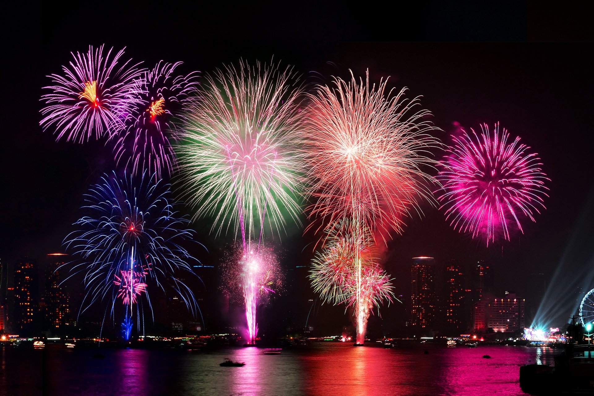 fireworks night lights colorful reflection water salute town