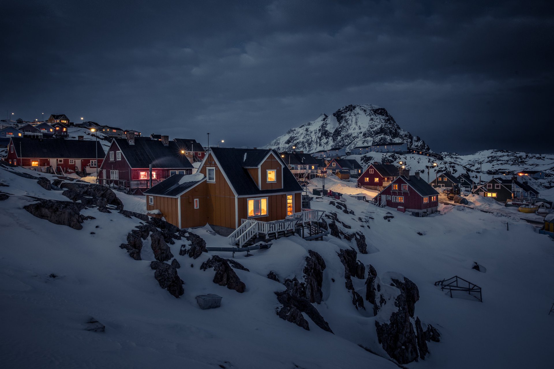 greenland sisimiut house lights snow night mountain gray clouds storm