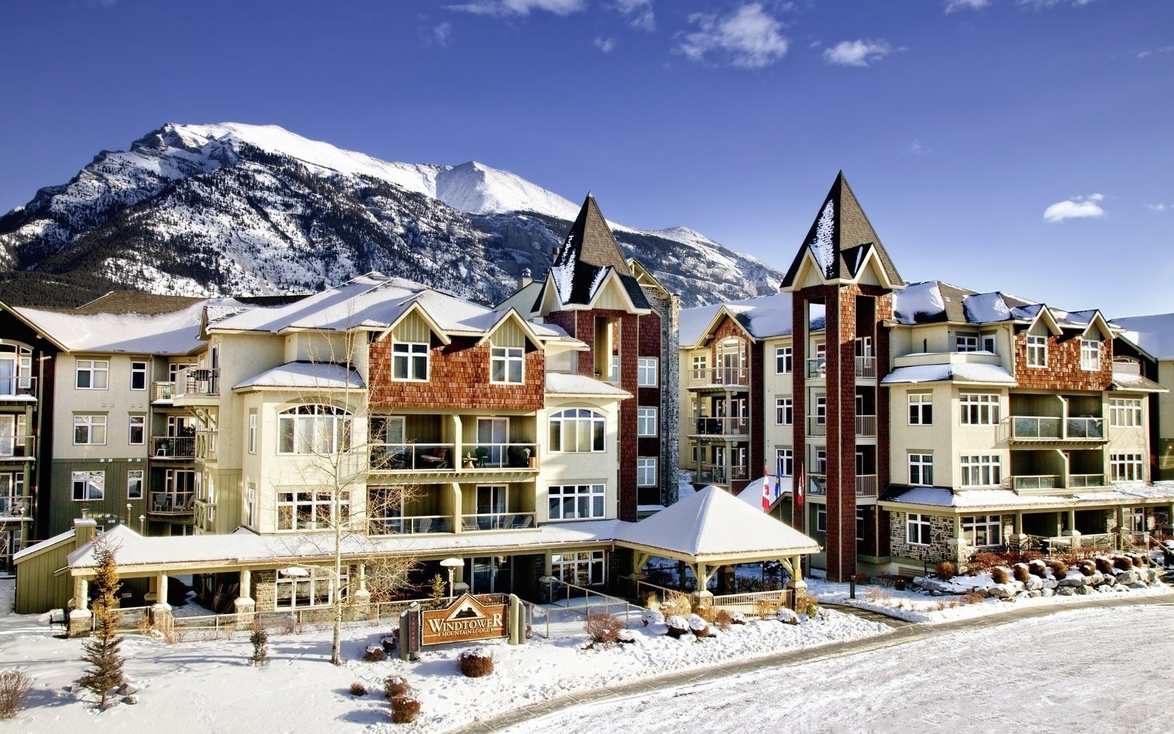 Winter town in Canada against the background of snow in the mountains