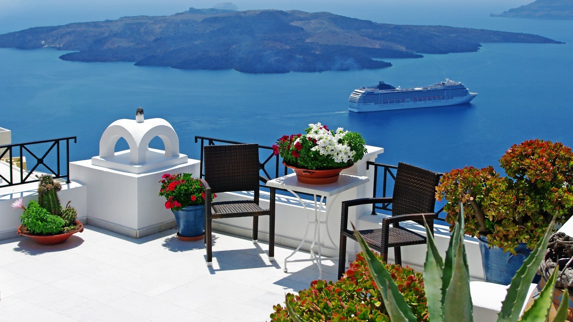 greece santorini aegean sea oia evening city lights church dome homes buildings