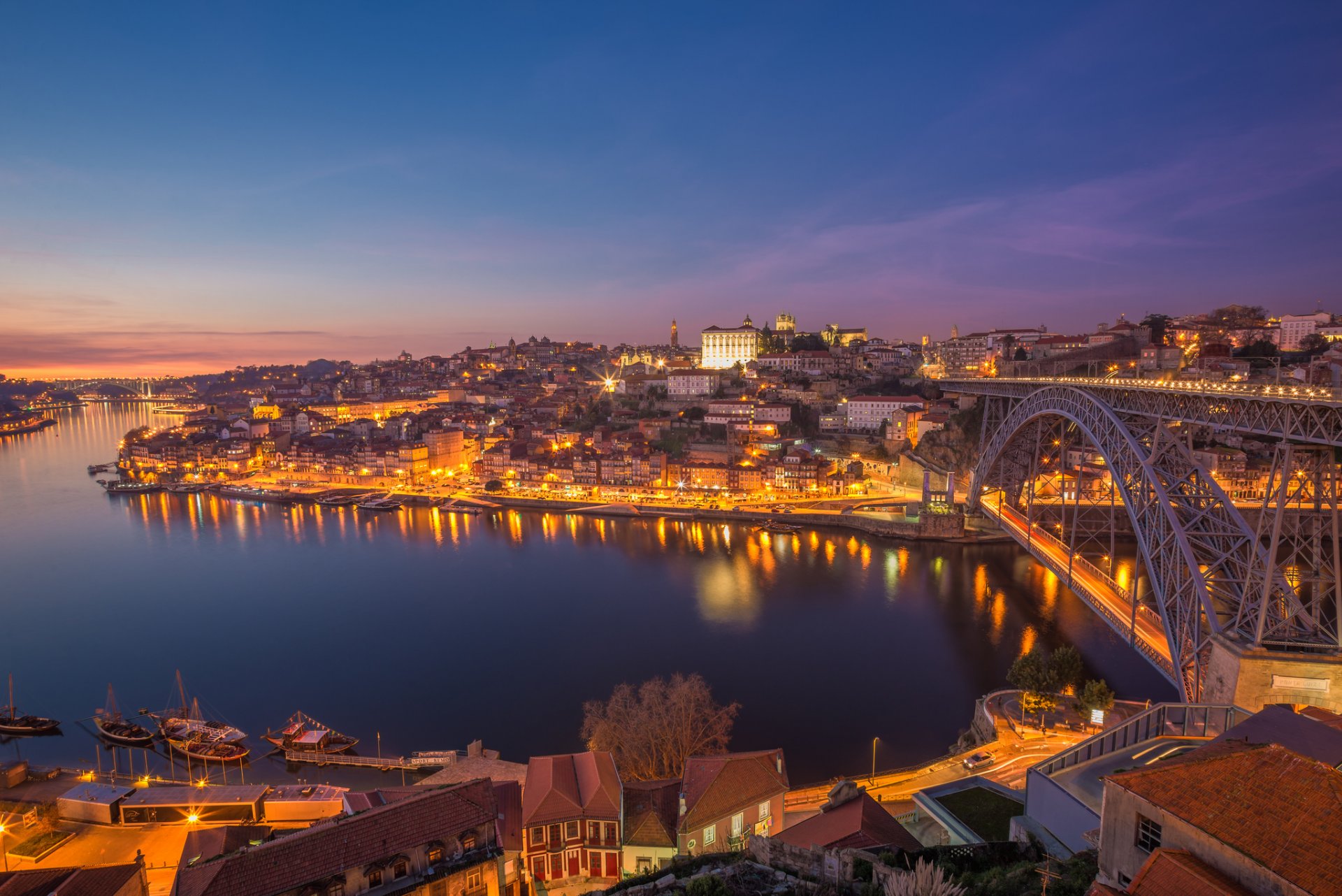 porto portugal town lights river bridge dawn