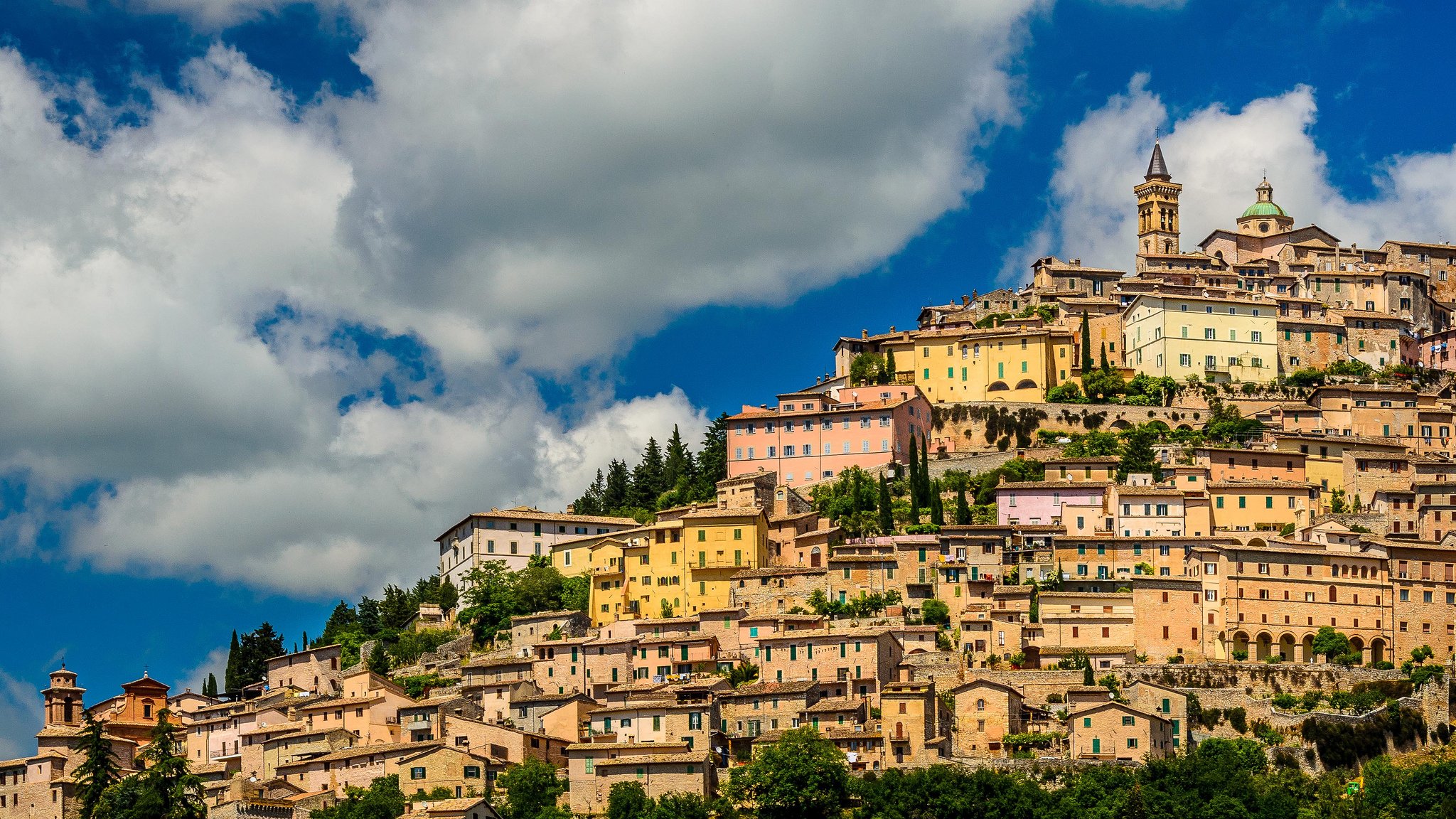 trevi umbria italy town buildings house slope clouds panorama