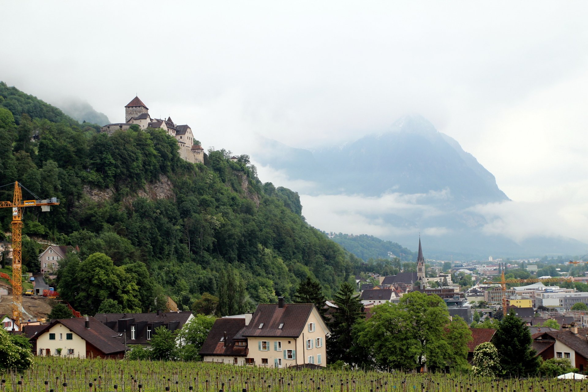 liechtenstein vaduz town house castle mountain rock landscape .