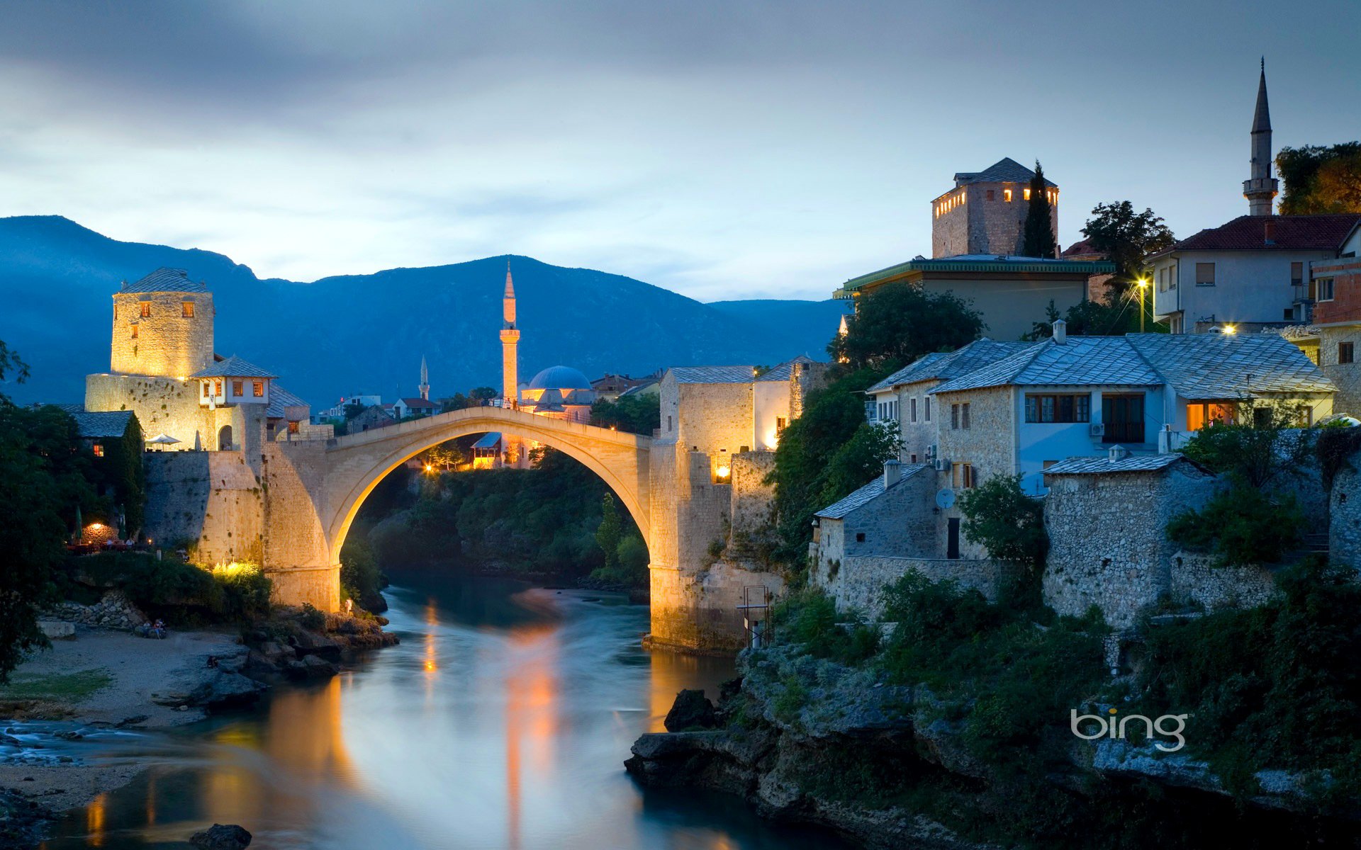 mostar bosnia and herzegovina sky sunset river bridge minaret house mountain landscape lights