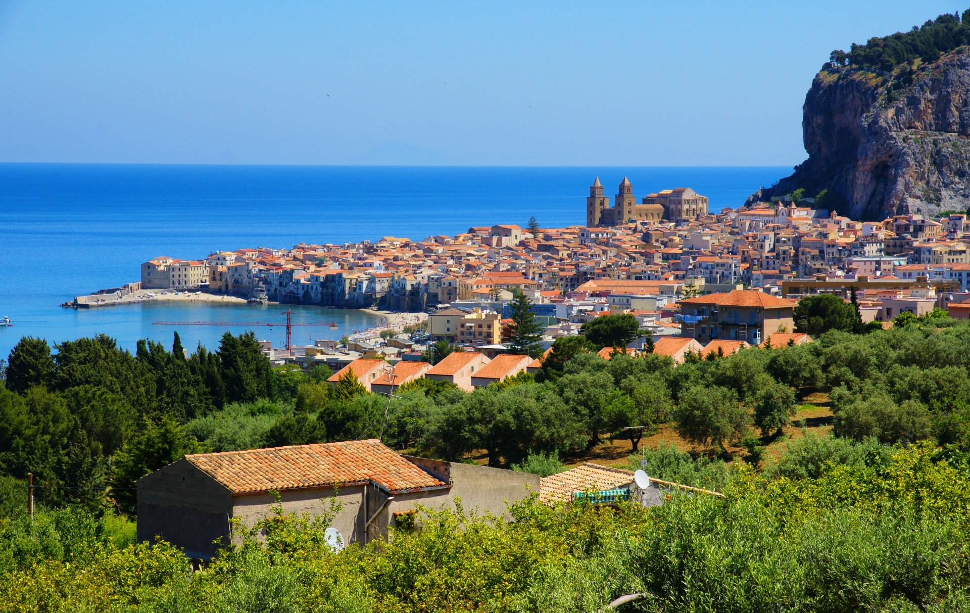 italy cefalu sicily italy sea town mountain house trees .