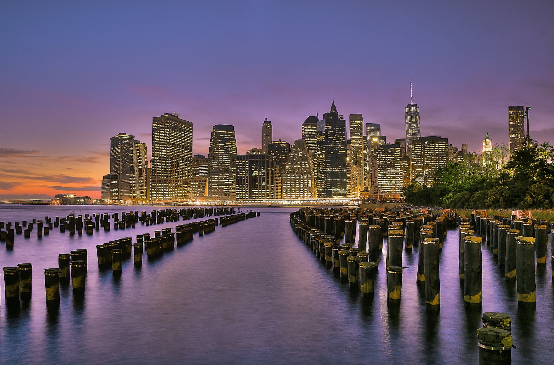 new york usa brooklyn bridge park lower manhattan east river united states town lights skyscraper buildings river of the support beach night sunset orange purple sky